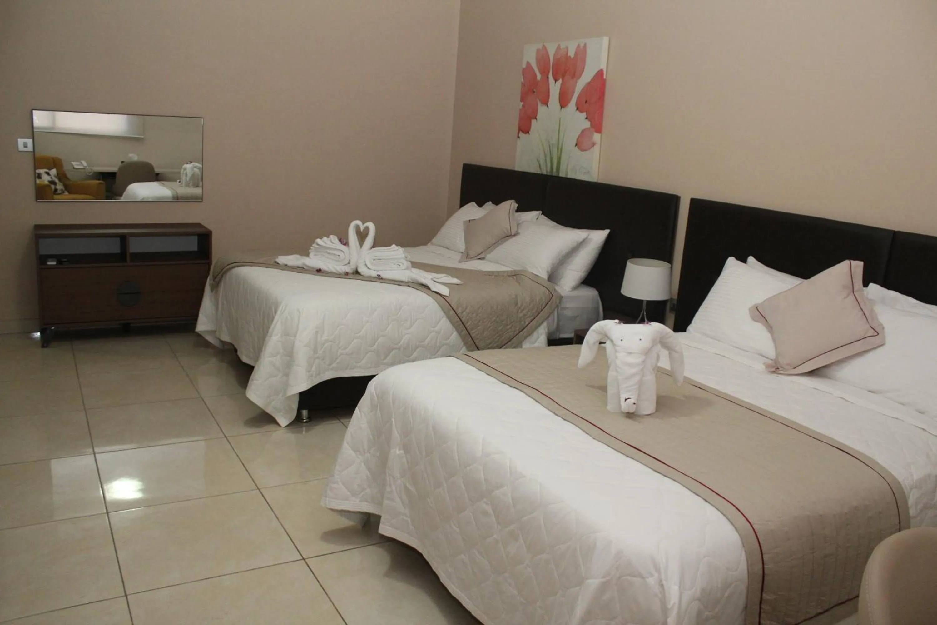 Bed in Murex Plaza Hotel & Suites