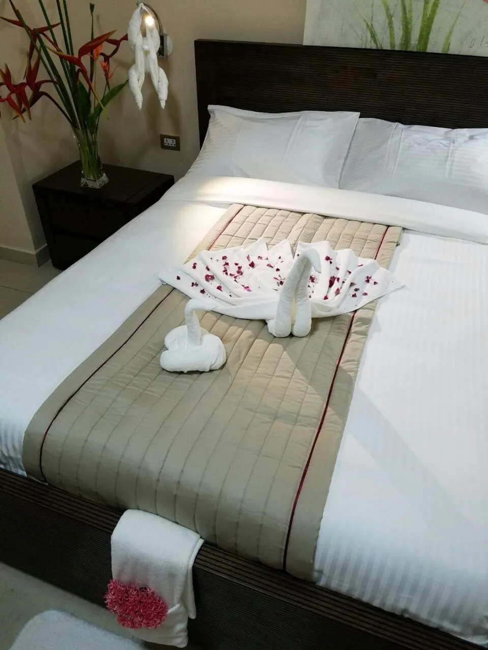 Bed in Murex Plaza Hotel & Suites