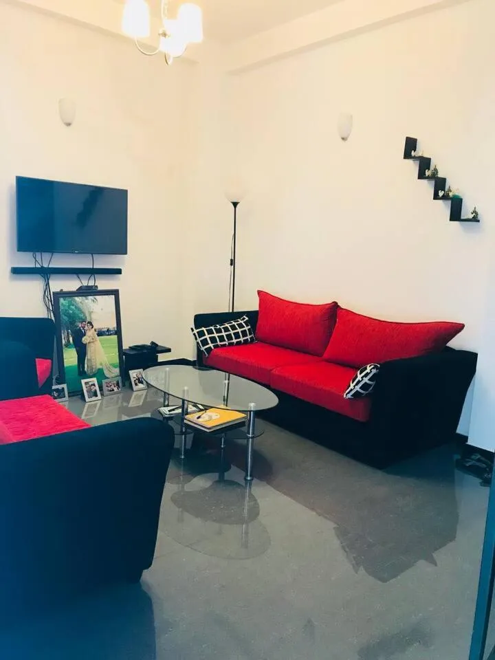 Communal lounge/ TV room in House of Seya