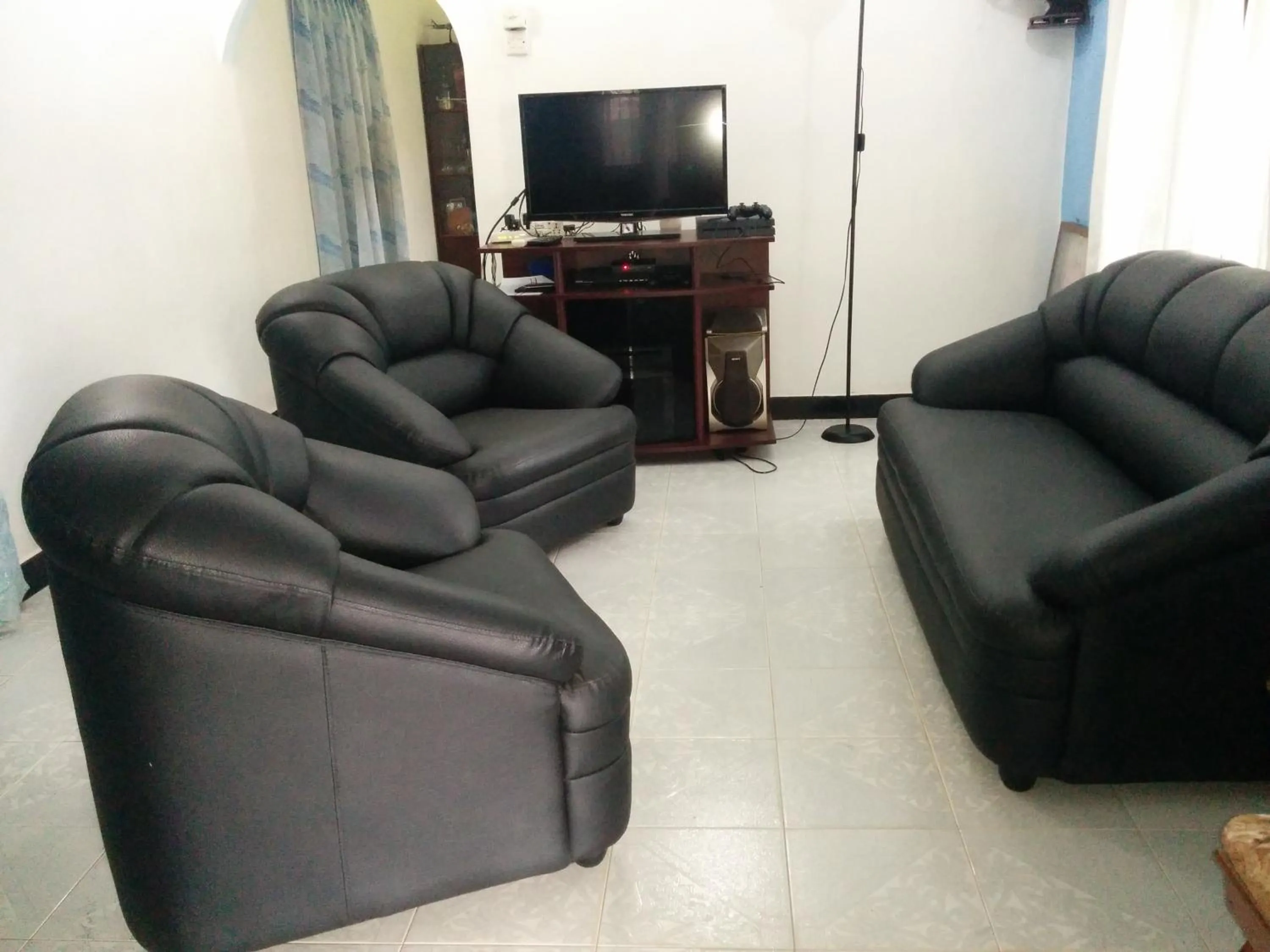 Communal lounge/ TV room in House of Seya