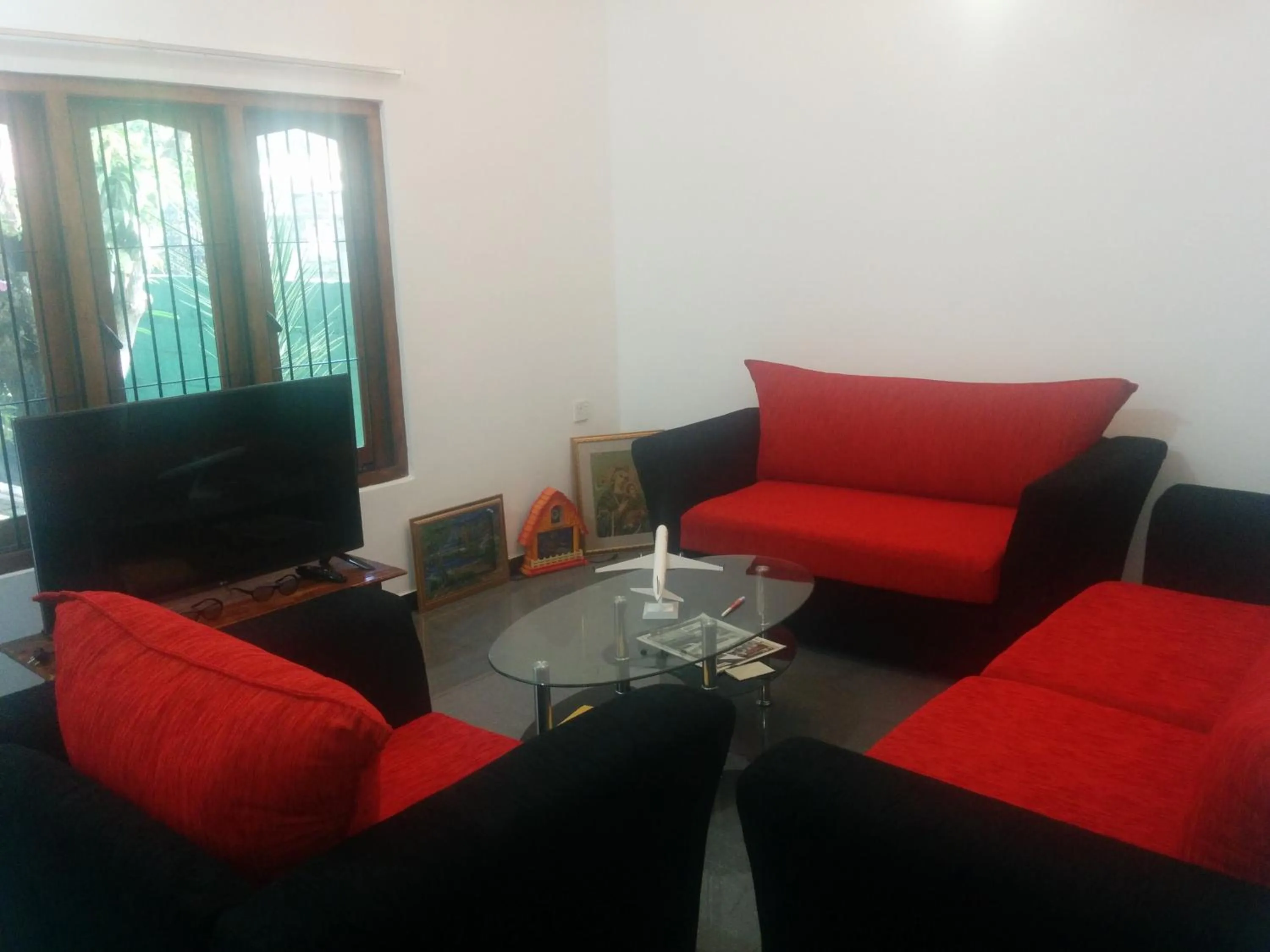 Communal lounge/ TV room in House of Seya