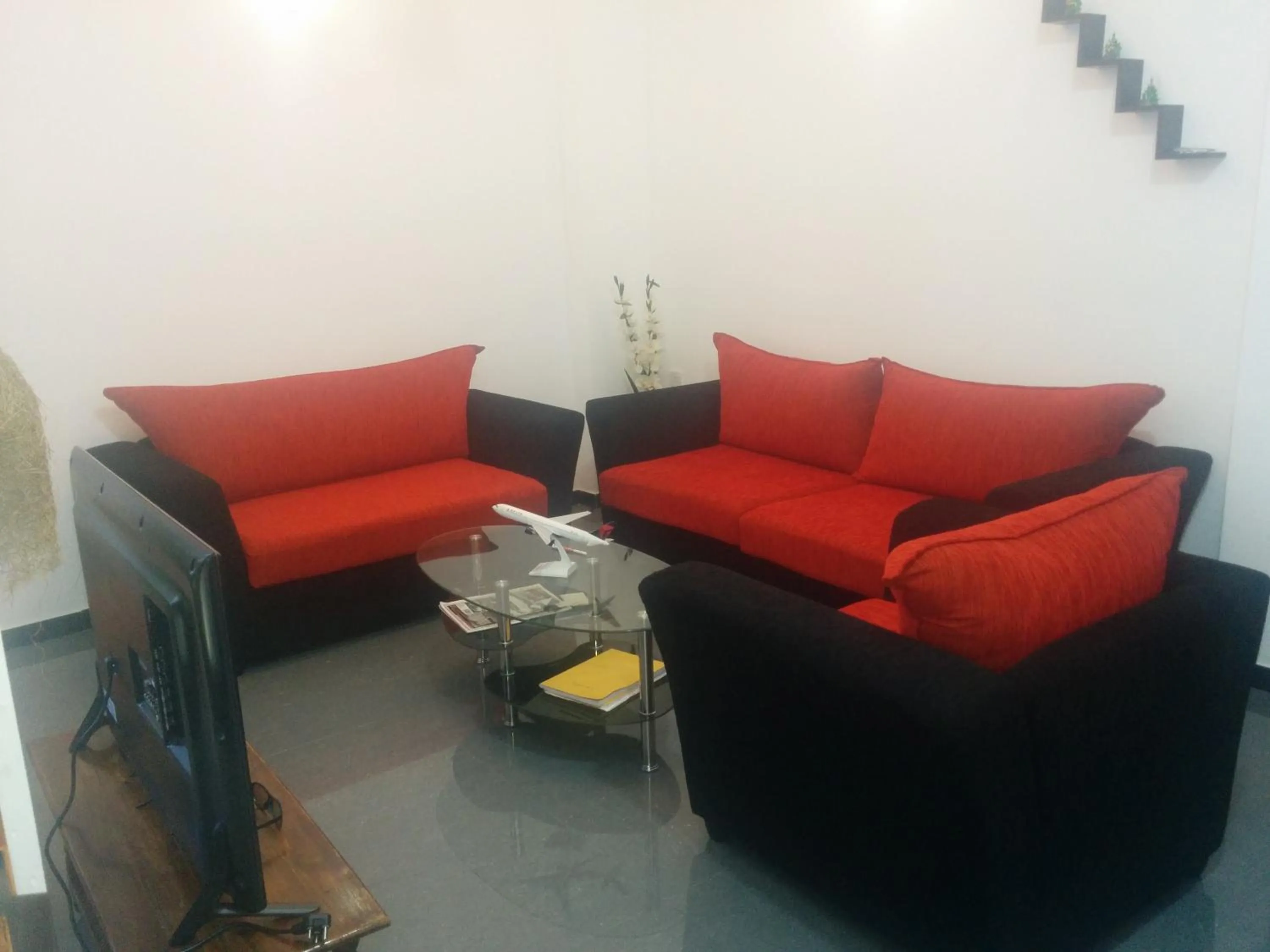 Communal lounge/ TV room in House of Seya