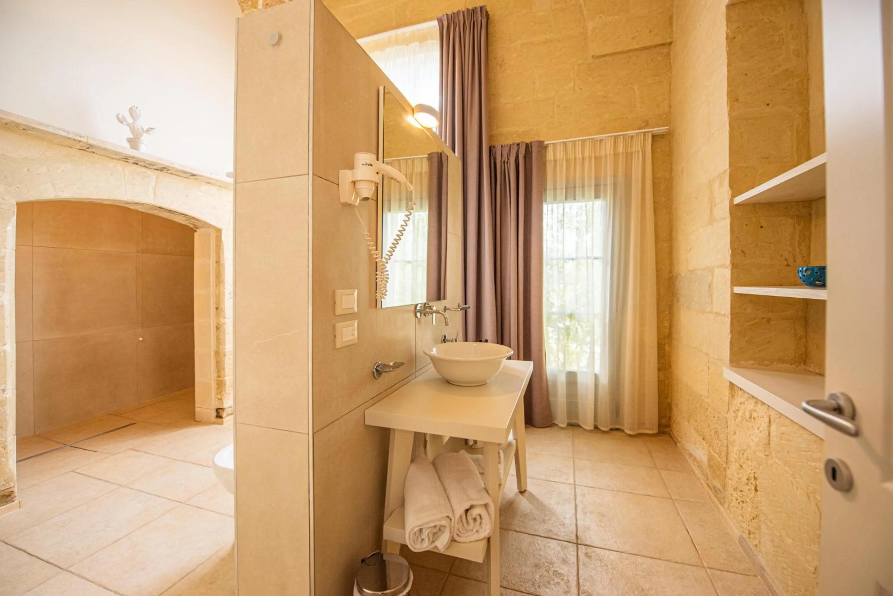 Bathroom in Relais Masseria Le Cesine - CDSHotels