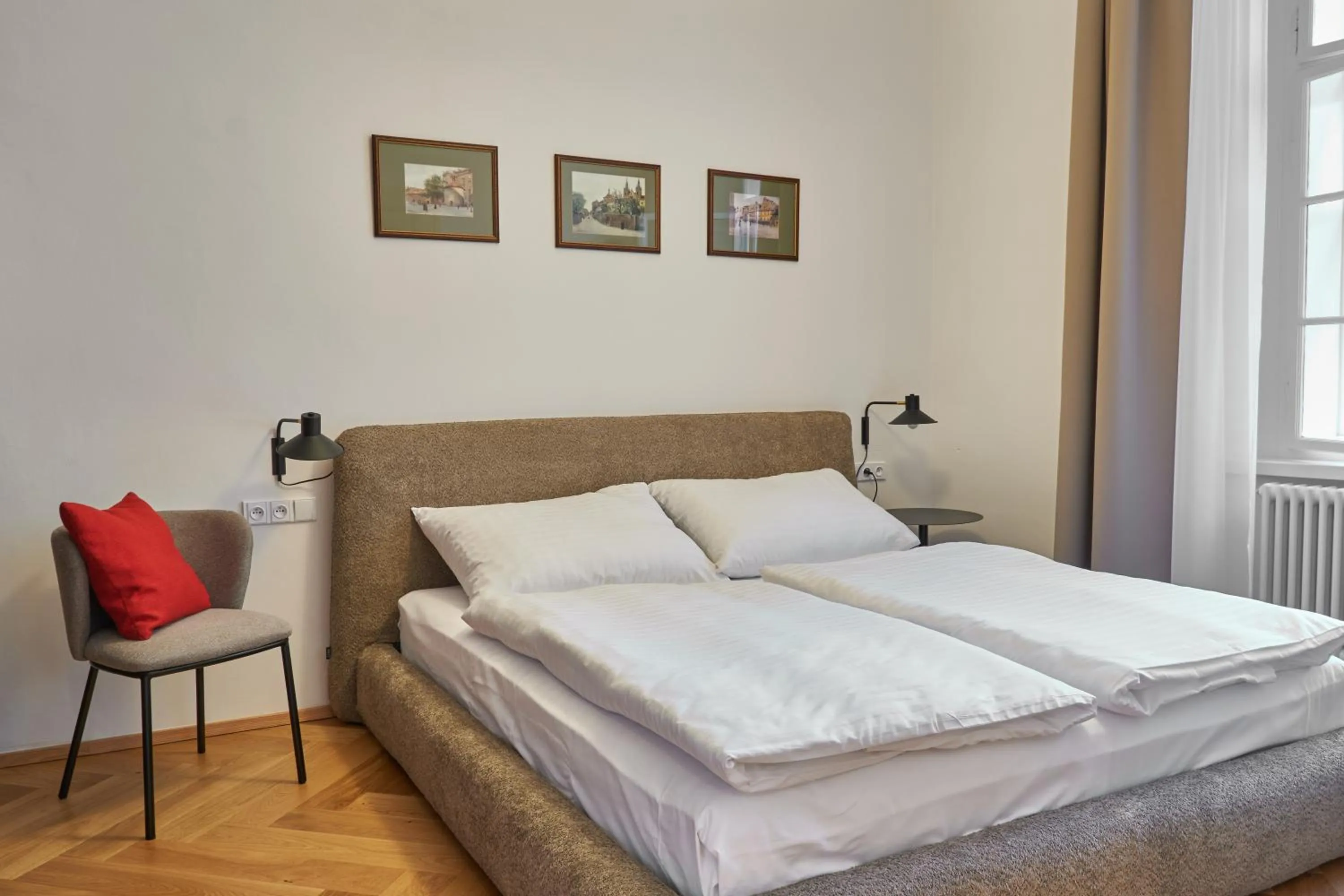 Bed in Three Golden Crowns Apartments