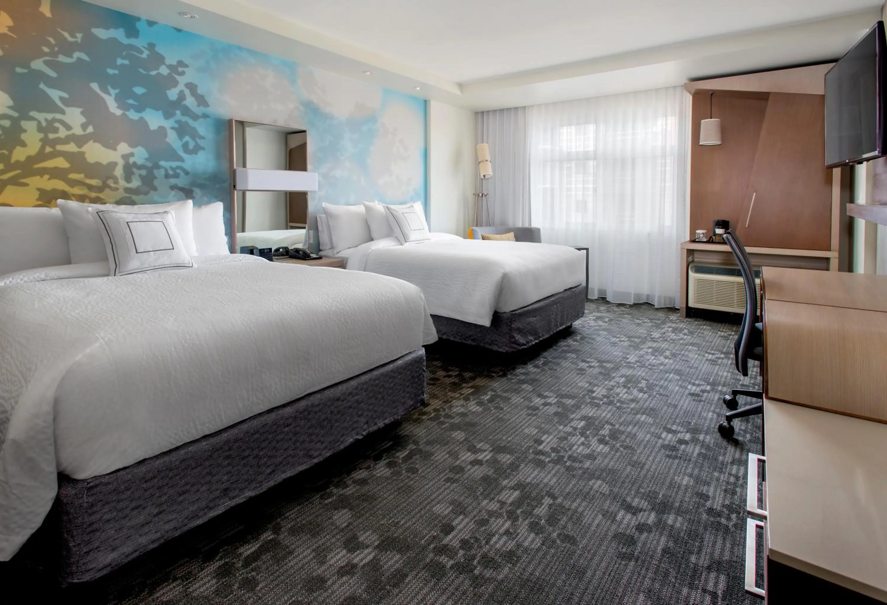 Bed in Courtyard by Marriott Schenectady at Mohawk Harbor