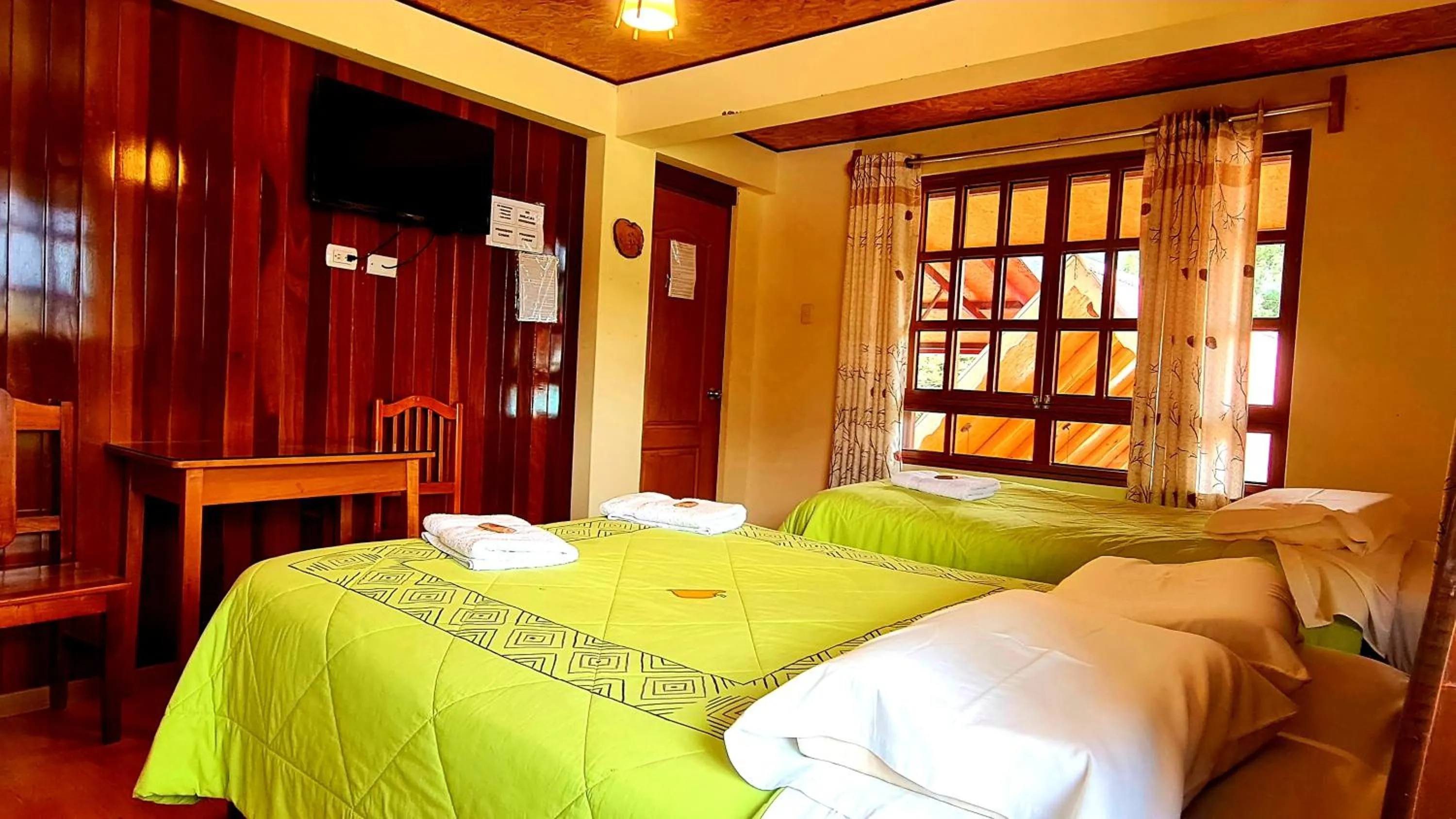 Bed in Tunki Lodge - Tours, Cabañas y Sauna