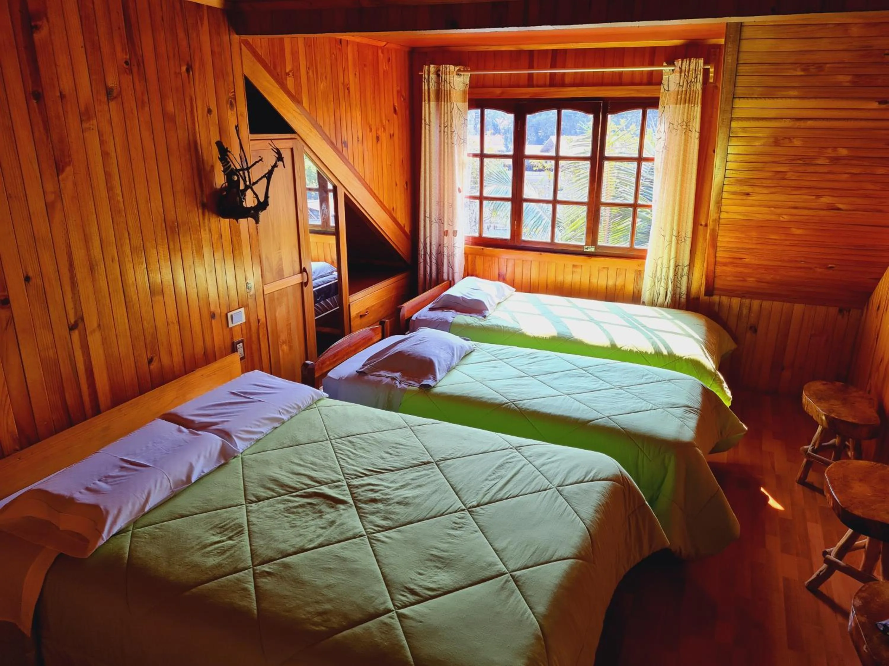 Photo of the whole room, Bed in Tunki Lodge - Tours, Cabañas y Sauna