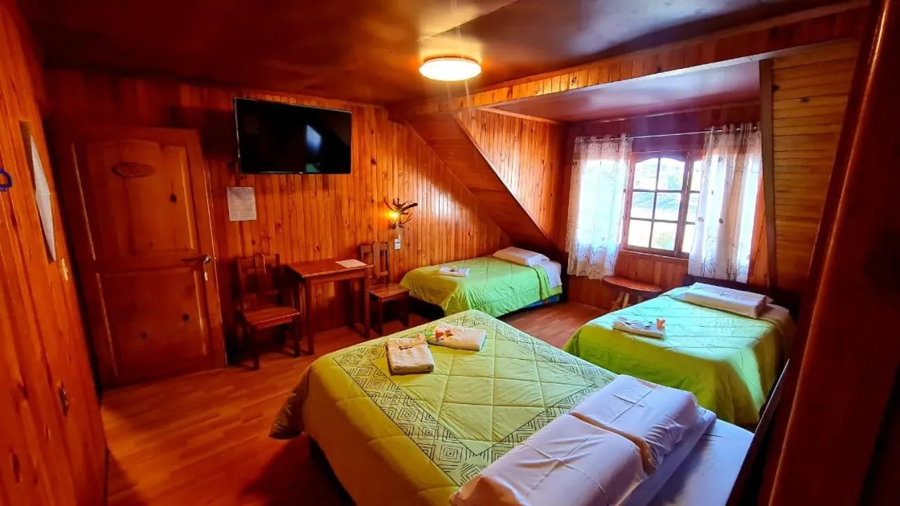 Photo of the whole room, Bed in Tunki Lodge - Tours, Cabañas y Sauna