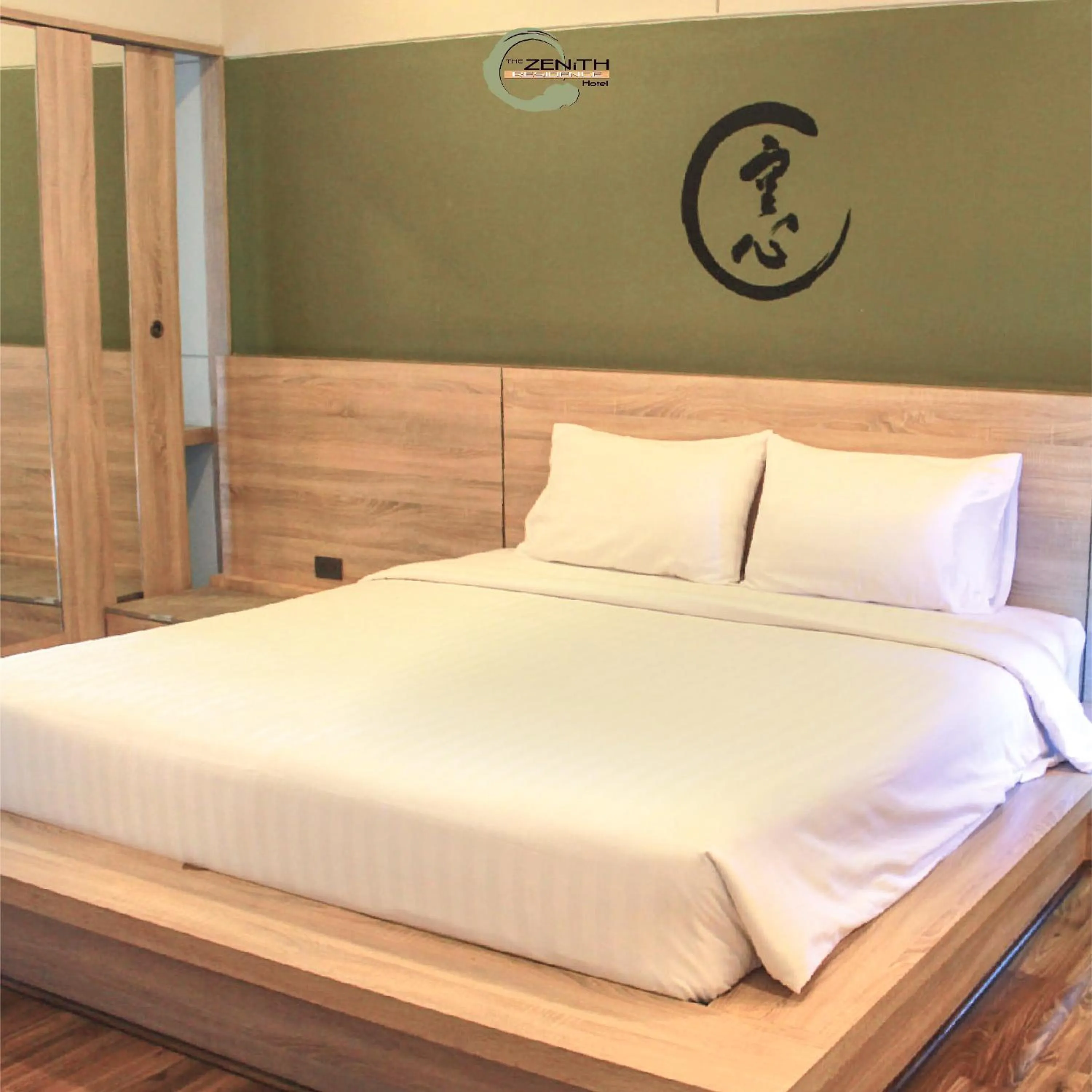 Bed in The Zenith Residence Hotel