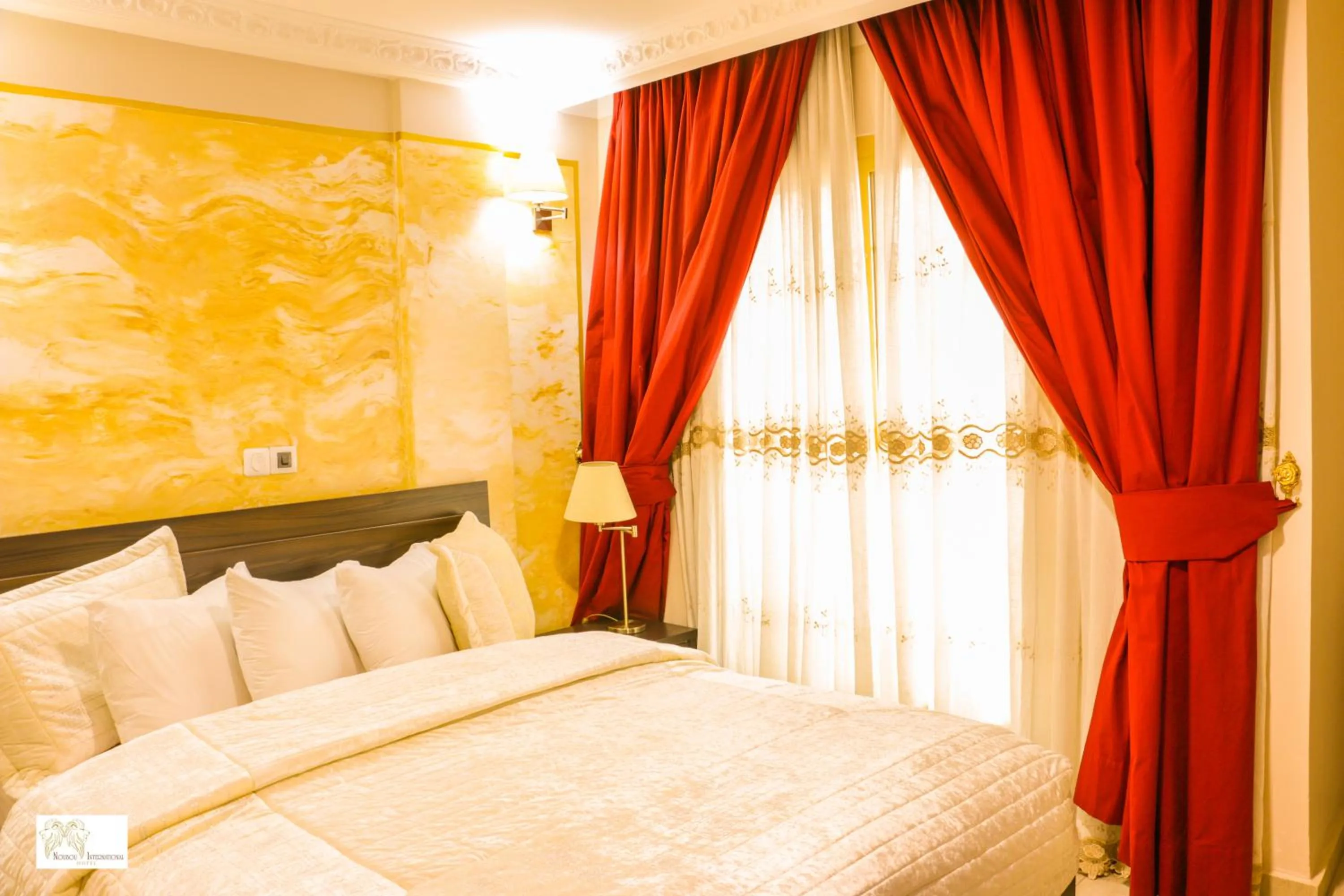 Bed in Noubou International Hotel