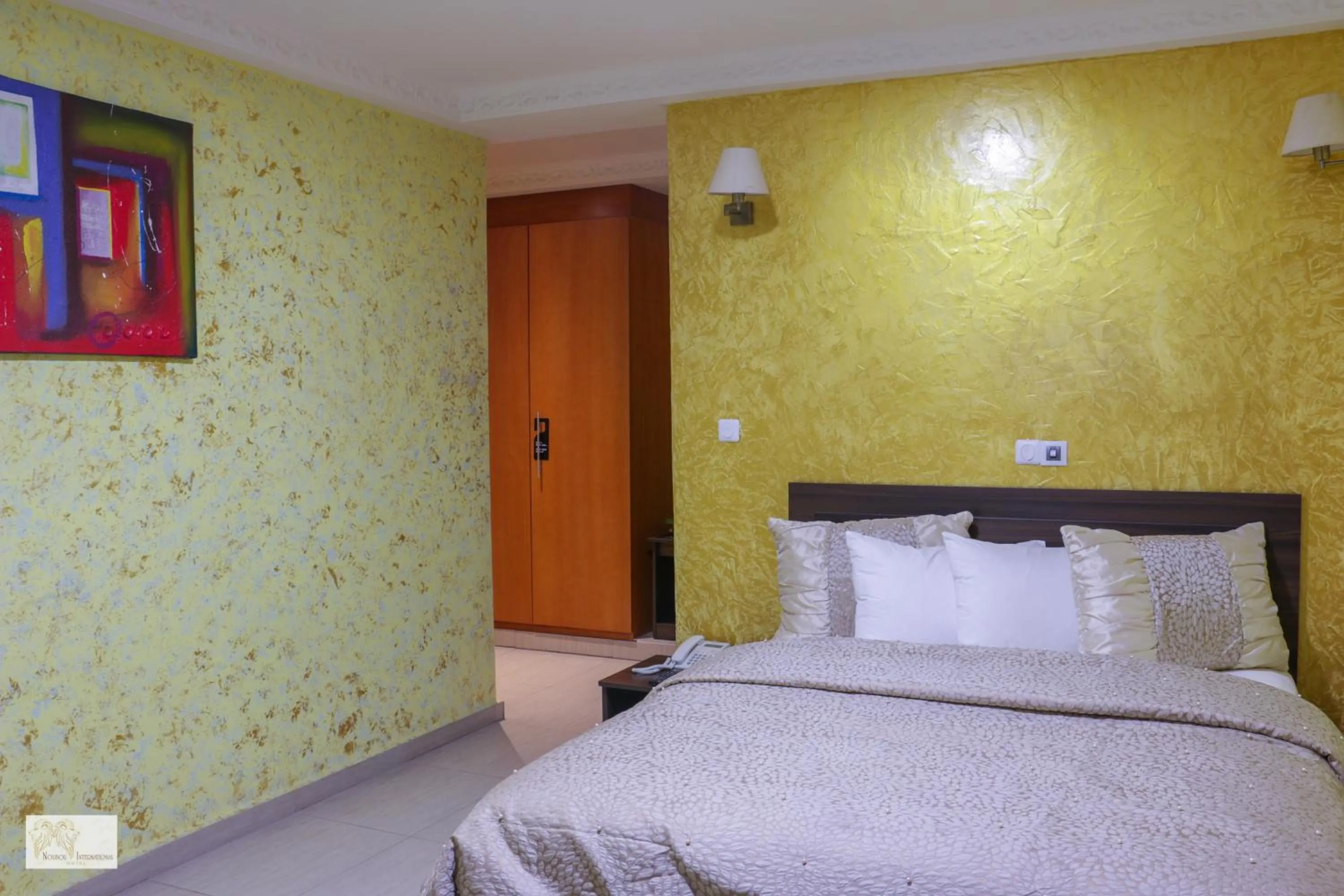 Bedroom in Noubou International Hotel