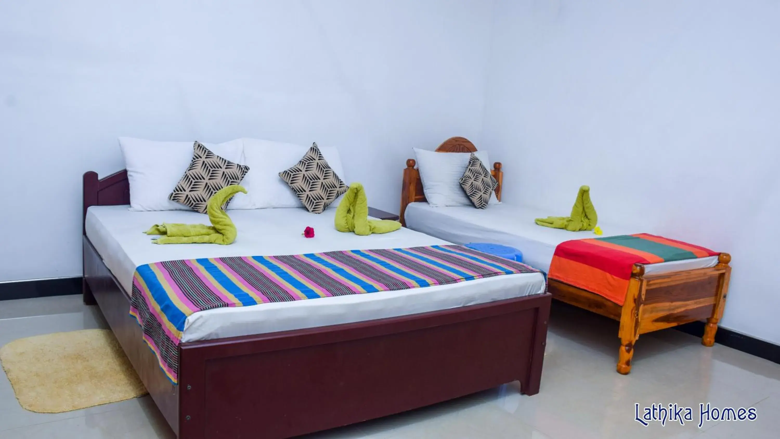 Deluxe Triple Room in Lathika Homes Deluxe Triple Room in Lathika Homes