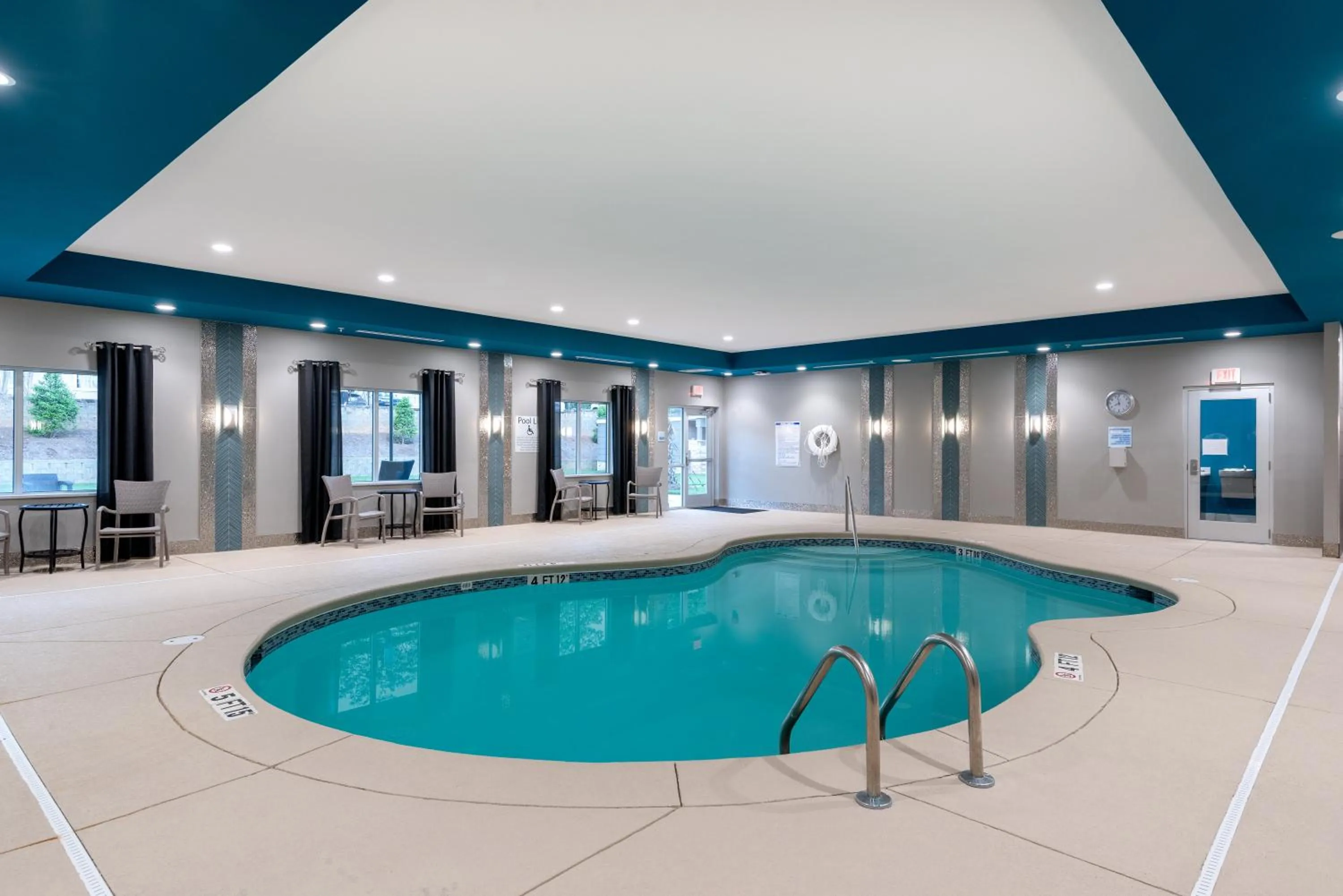 Swimming pool in Holiday Inn Express & Suites - Charlotte Airport by IHG
