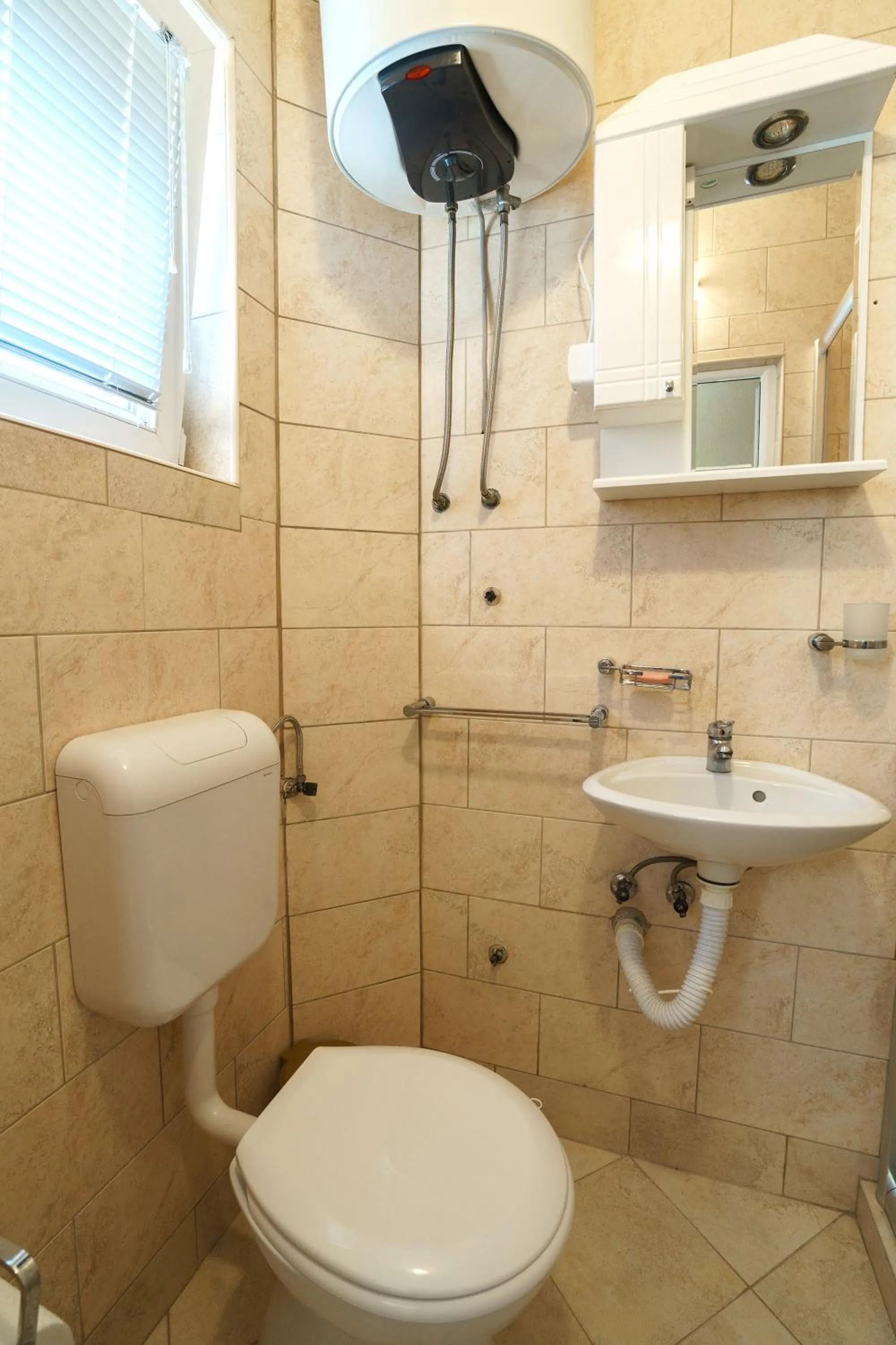 Toilet in Apartments Lora