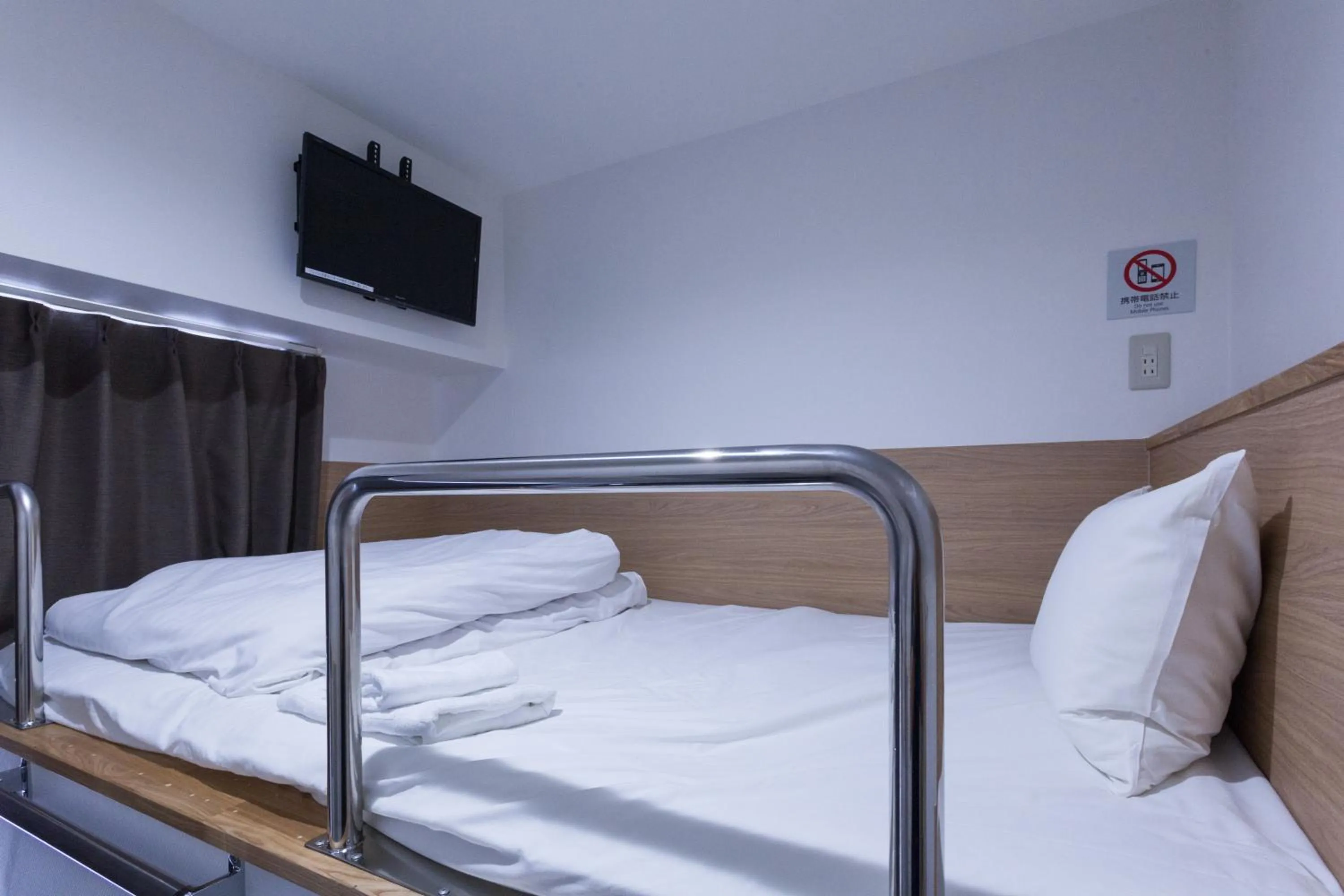 Photo of the whole room, Bed in HOTEL THE CUBE Naha Kokusai Street