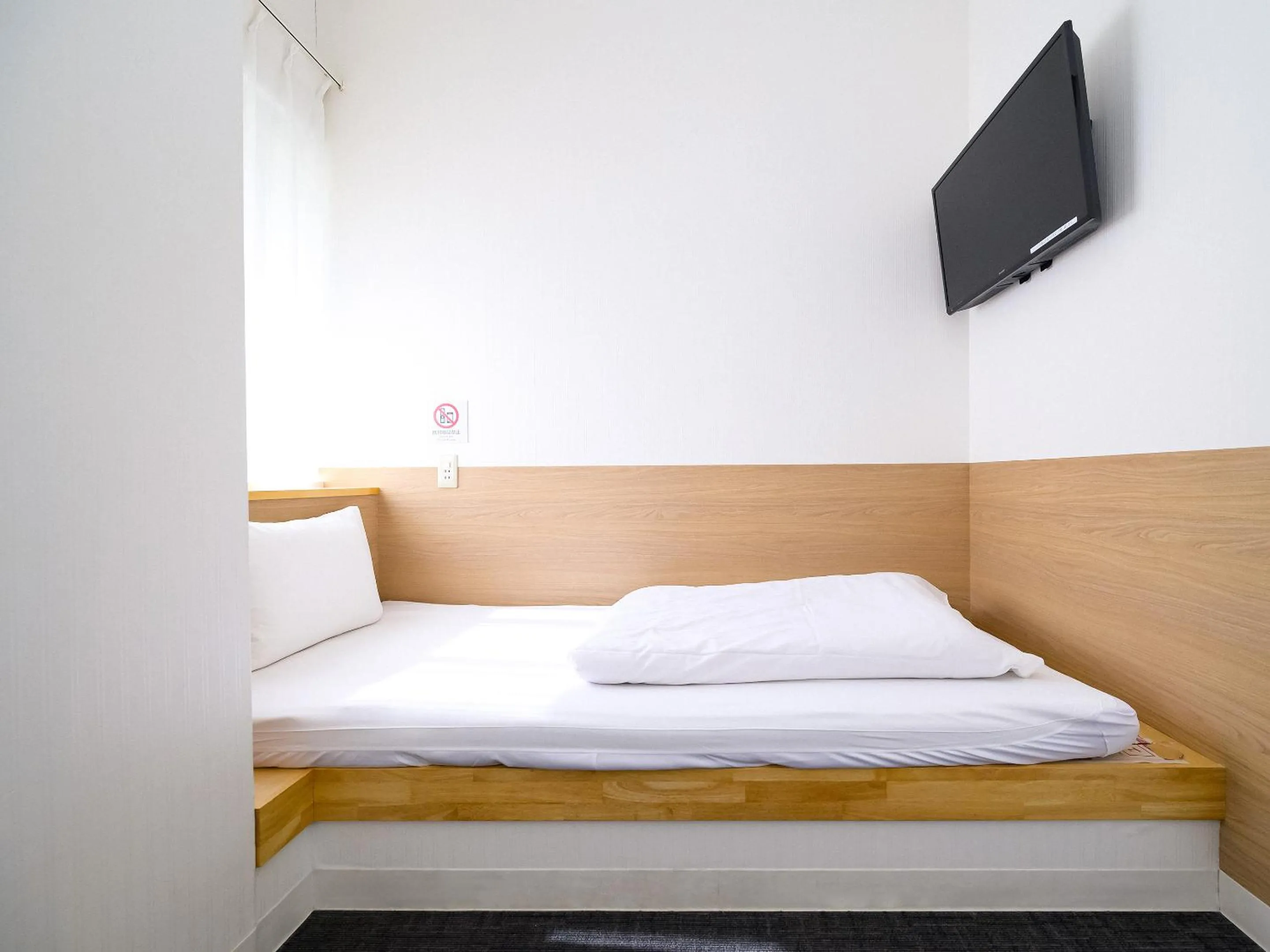 Photo of the whole room, Bed in HOTEL THE CUBE Naha Kokusai Street