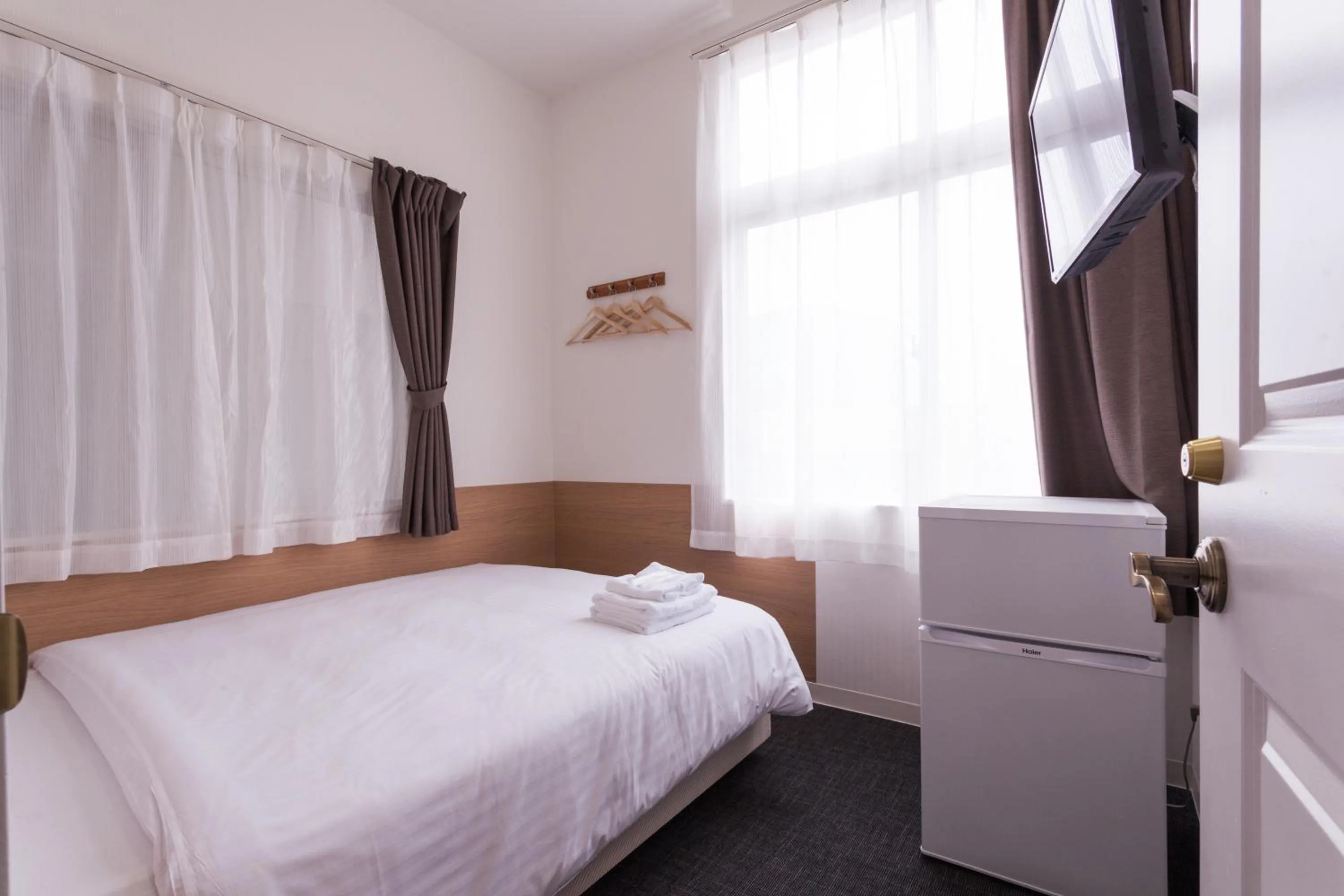 Photo of the whole room, Bed in HOTEL THE CUBE Naha Kokusai Street