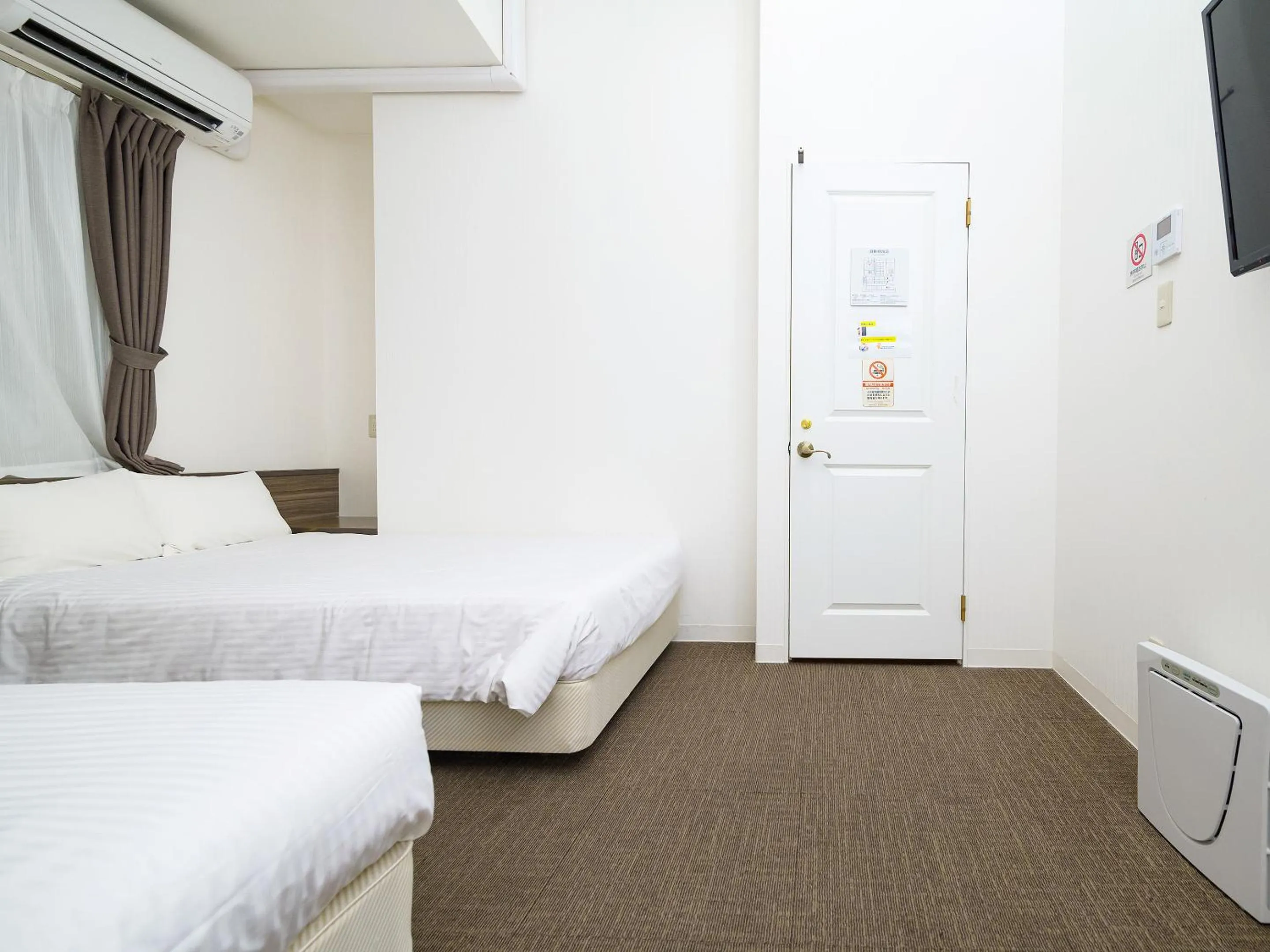 Photo of the whole room, Bed in HOTEL THE CUBE Naha Kokusai Street