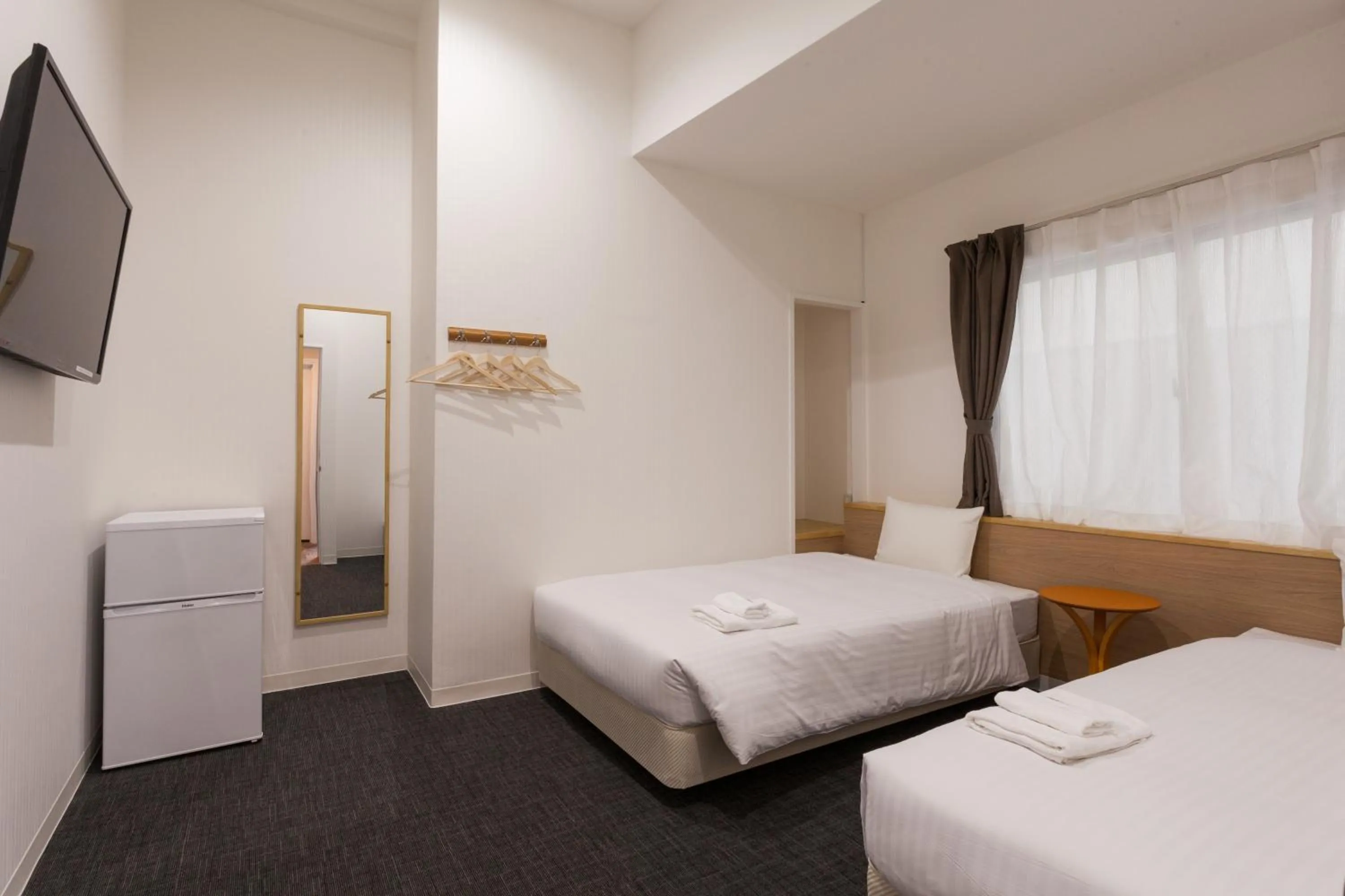 Photo of the whole room, Bed in HOTEL THE CUBE Naha Kokusai Street