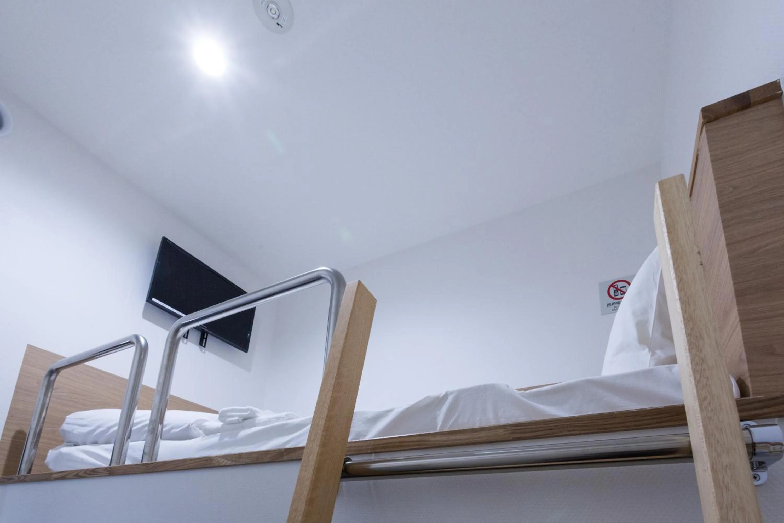 Photo of the whole room, Bed in HOTEL THE CUBE Naha Kokusai Street