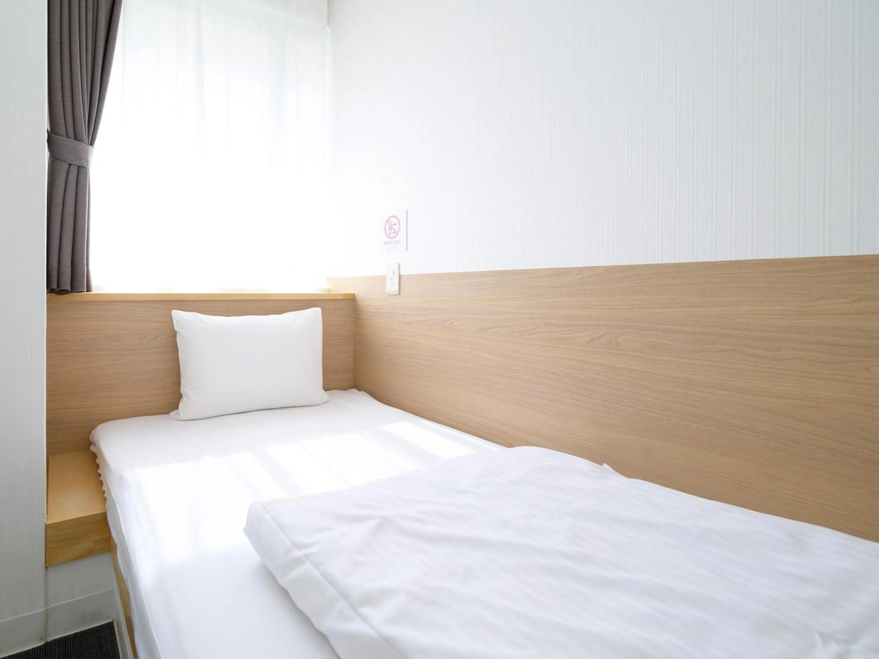 Bed in HOTEL THE CUBE Naha Kokusai Street