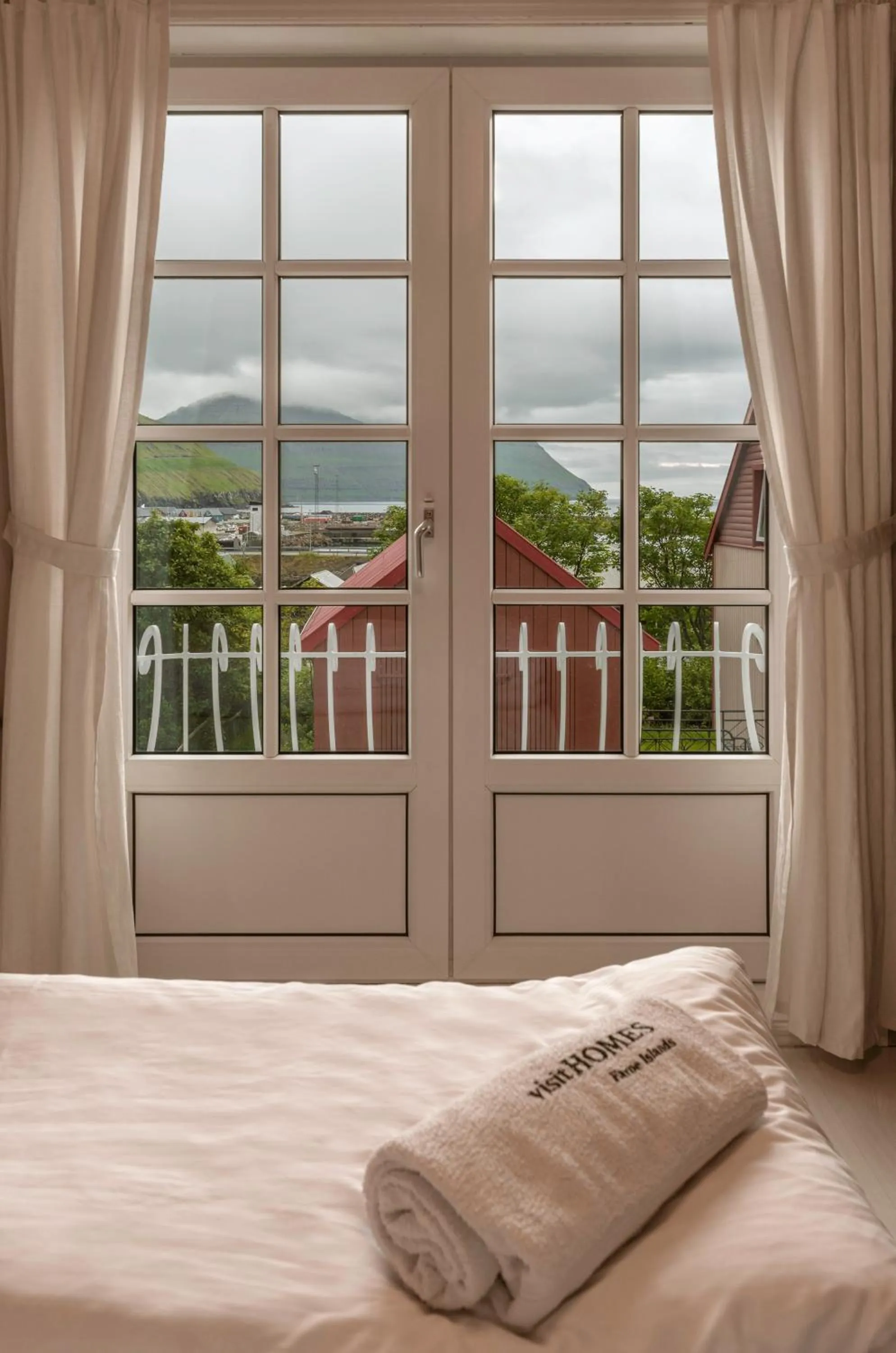View (from property/room), Bed in visitHOMES Faroe Islands