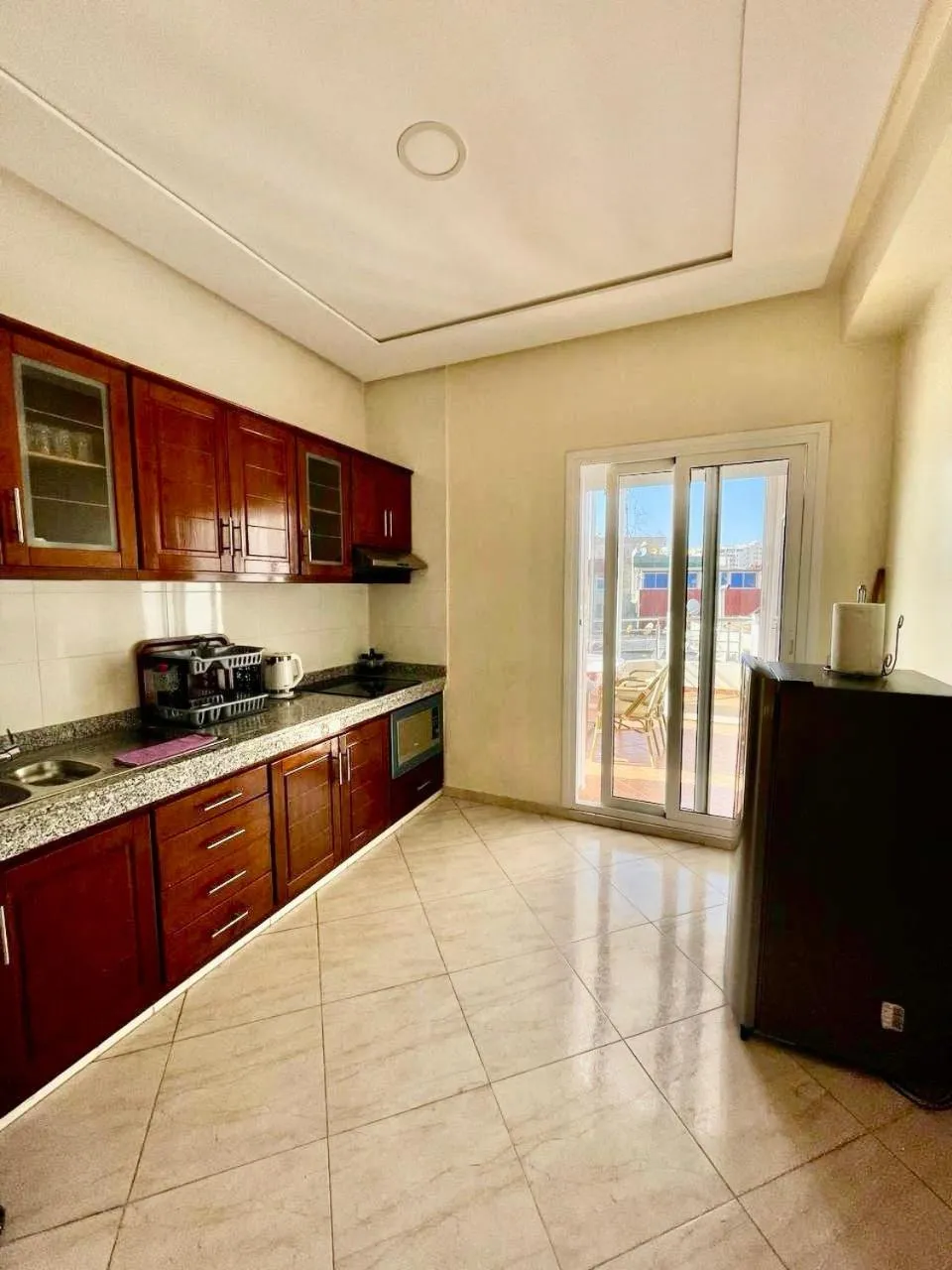 Kitchen or kitchenette in Appart Hotel Rania