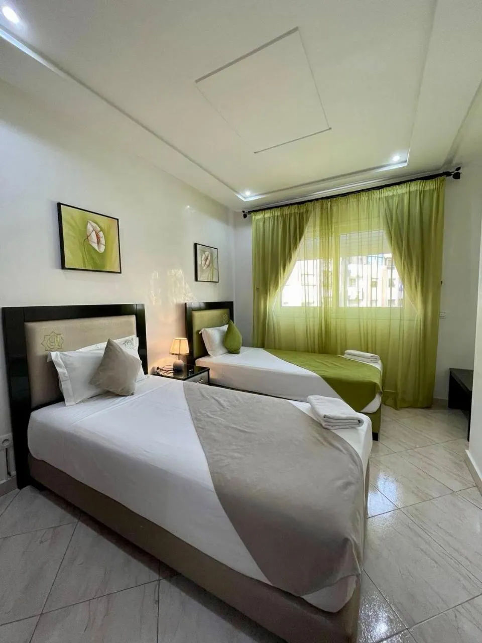 Bed in Appart Hotel Rania