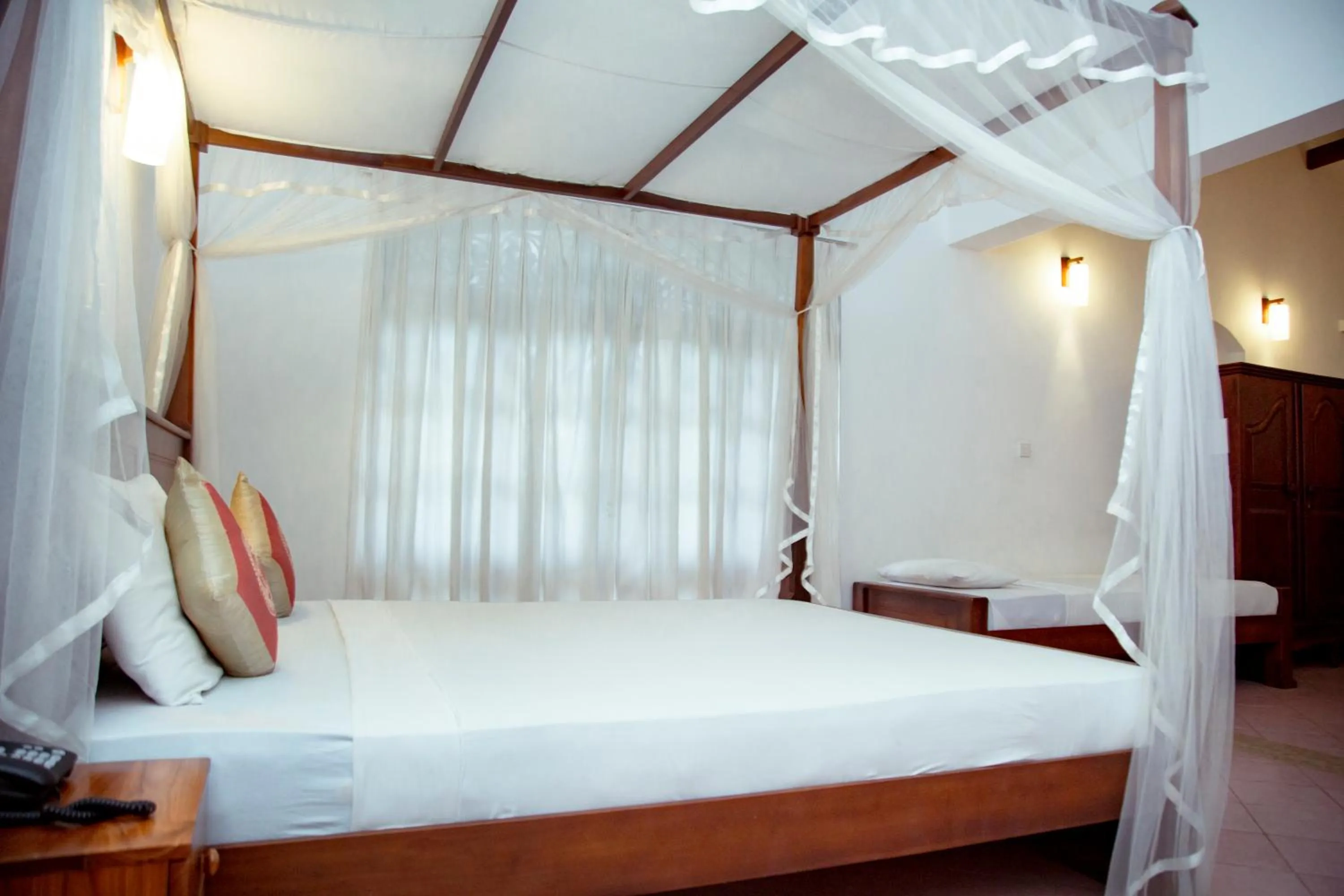 Bed in Prince Beach Hotel Bentota