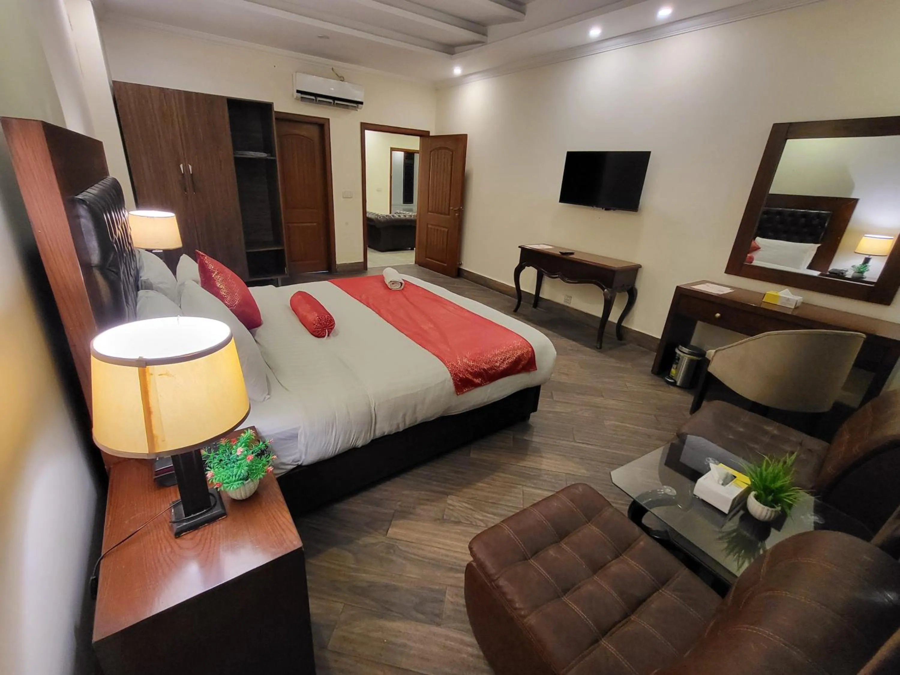 Communal lounge/ TV room, Bed in Grand Millennium Hotel