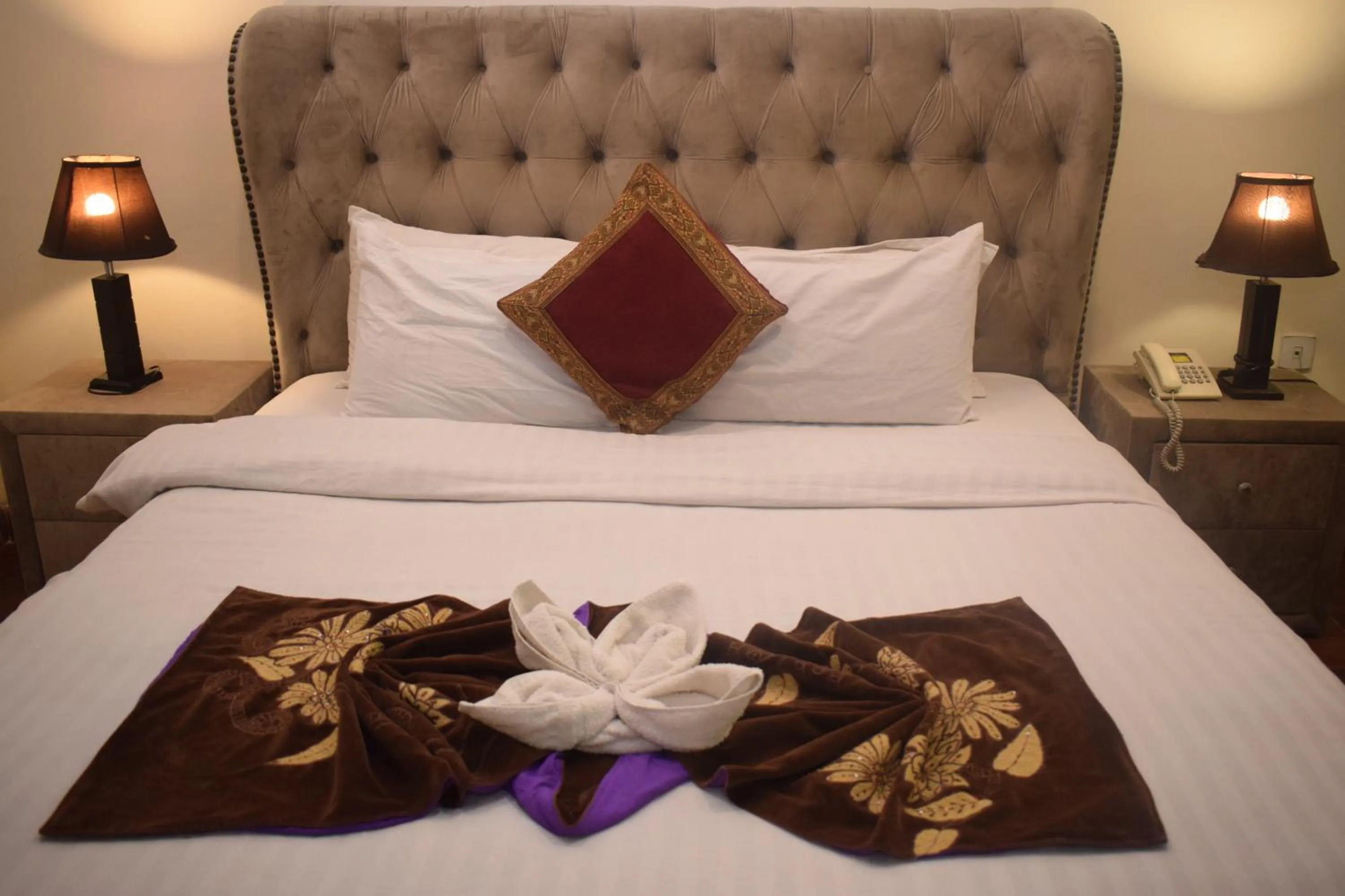 Bed in Grand Millennium Hotel