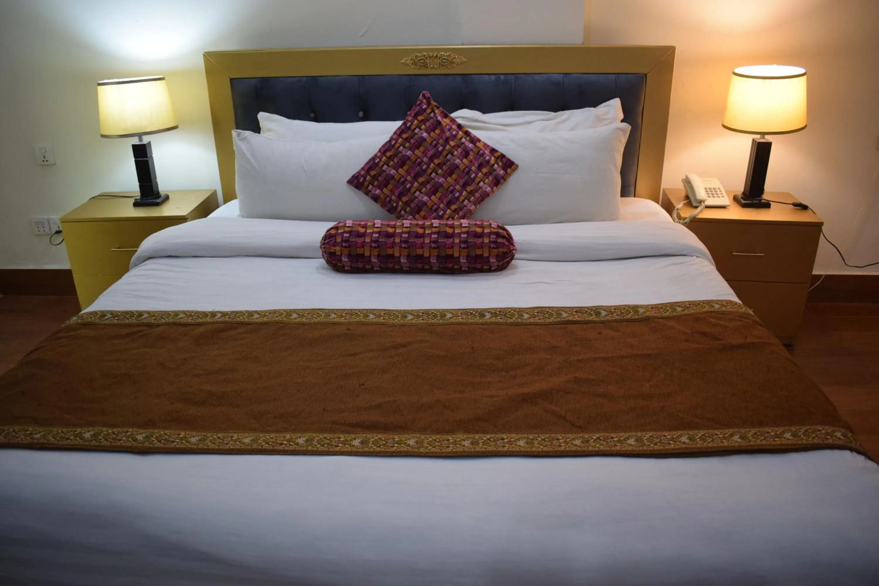 Bed in Grand Millennium Hotel
