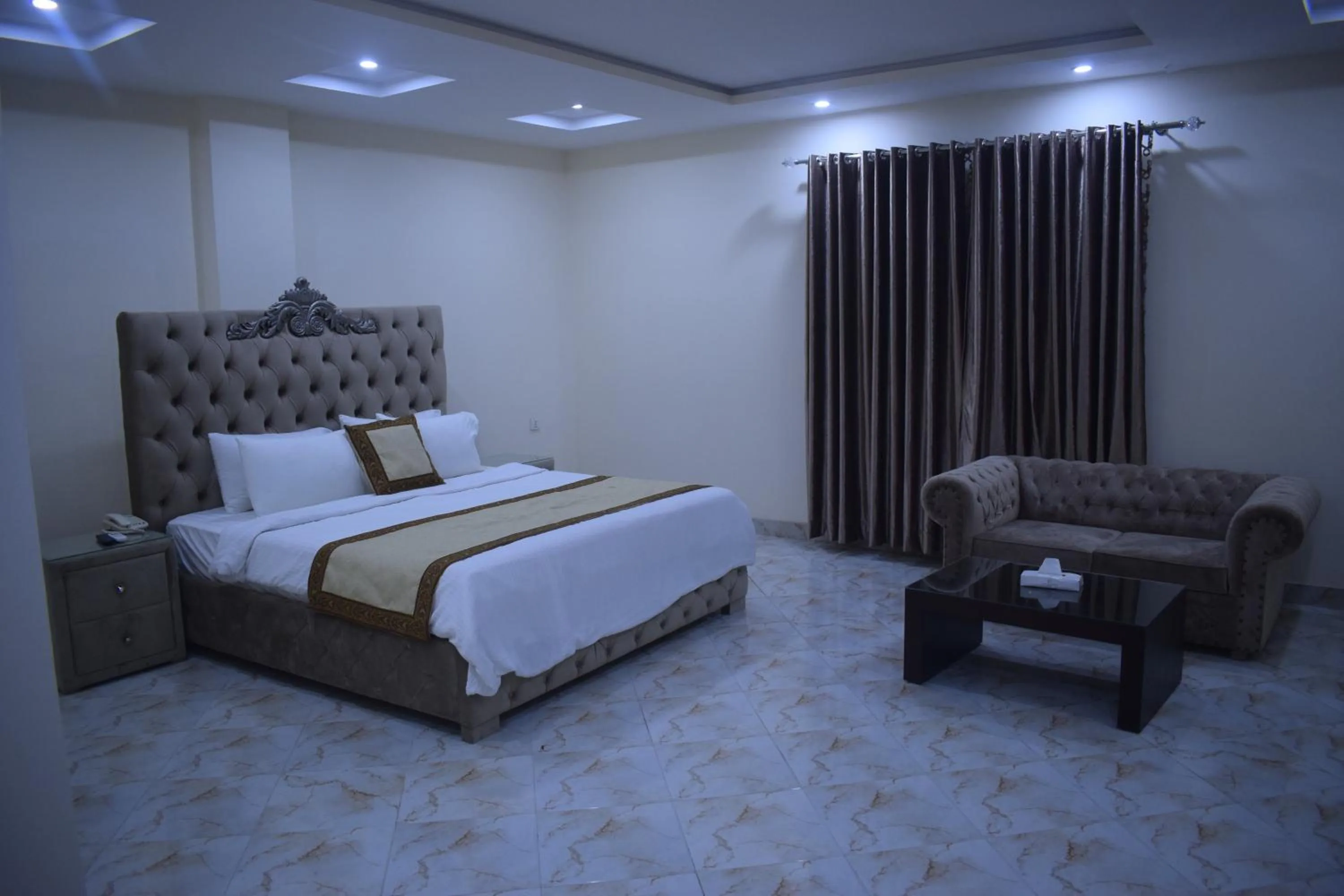 Photo of the whole room, Bed in Grand Millennium Hotel