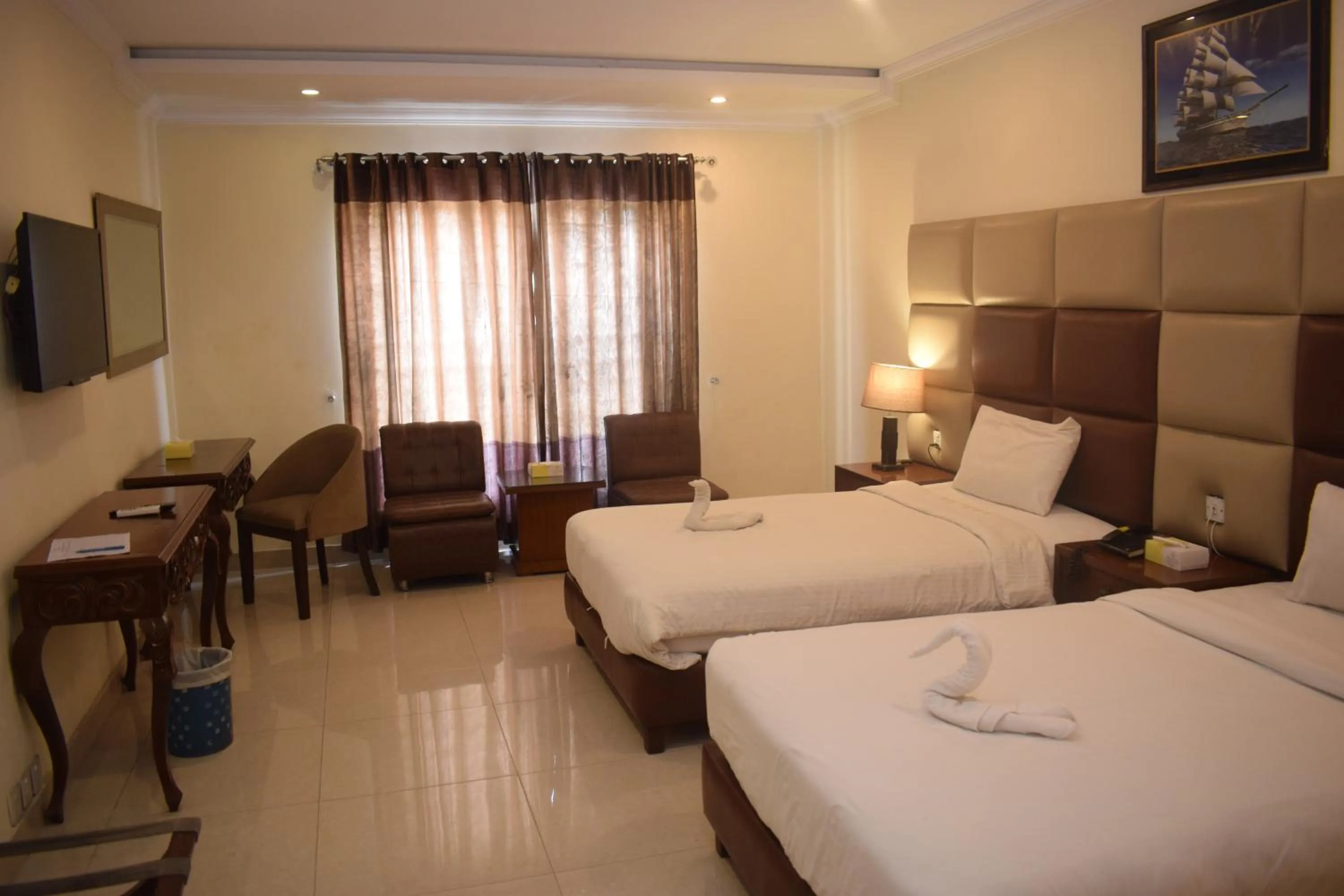 Bed in Grand Millennium Hotel