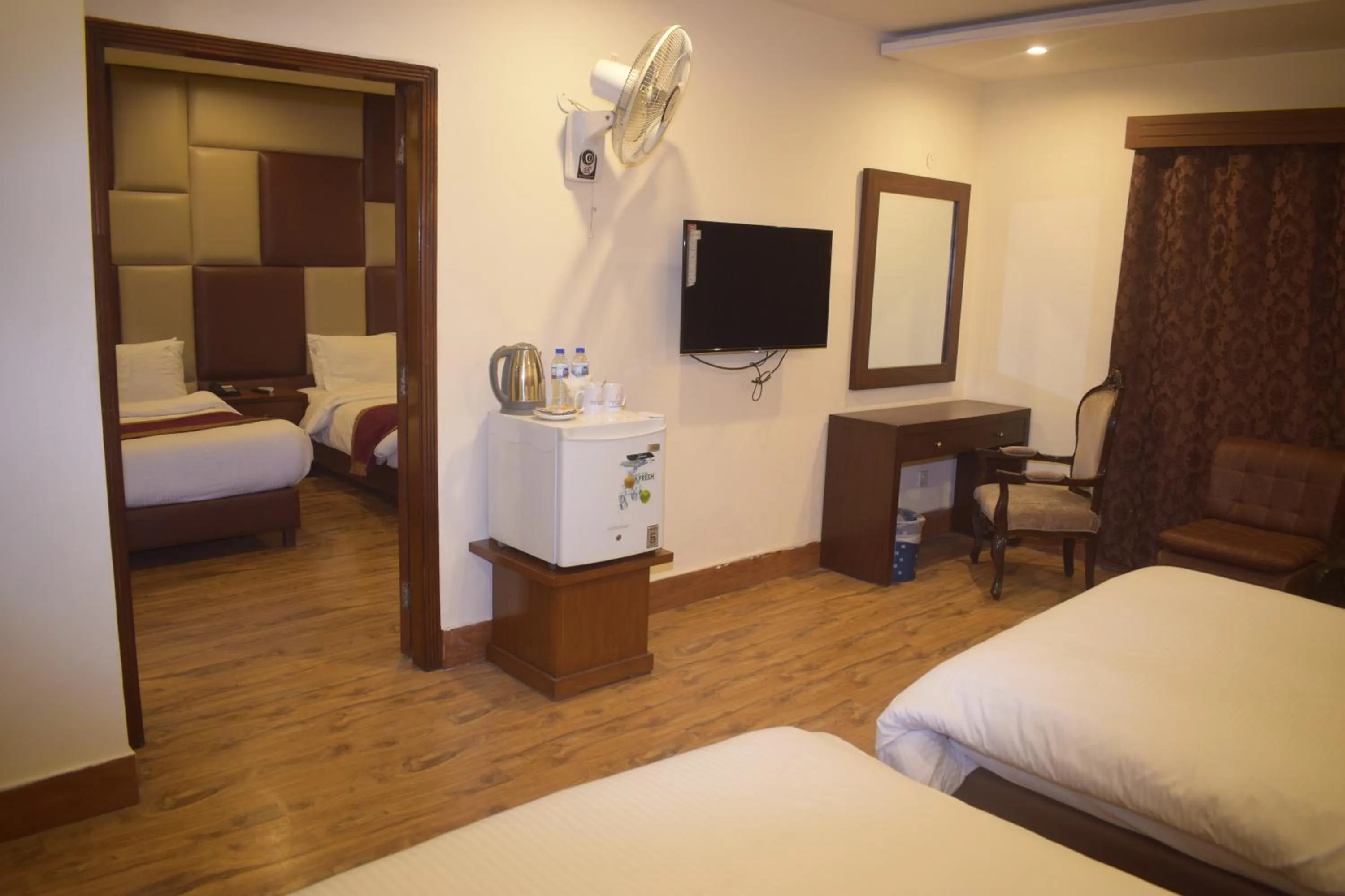 Communal lounge/ TV room, Bed in Grand Millennium Hotel