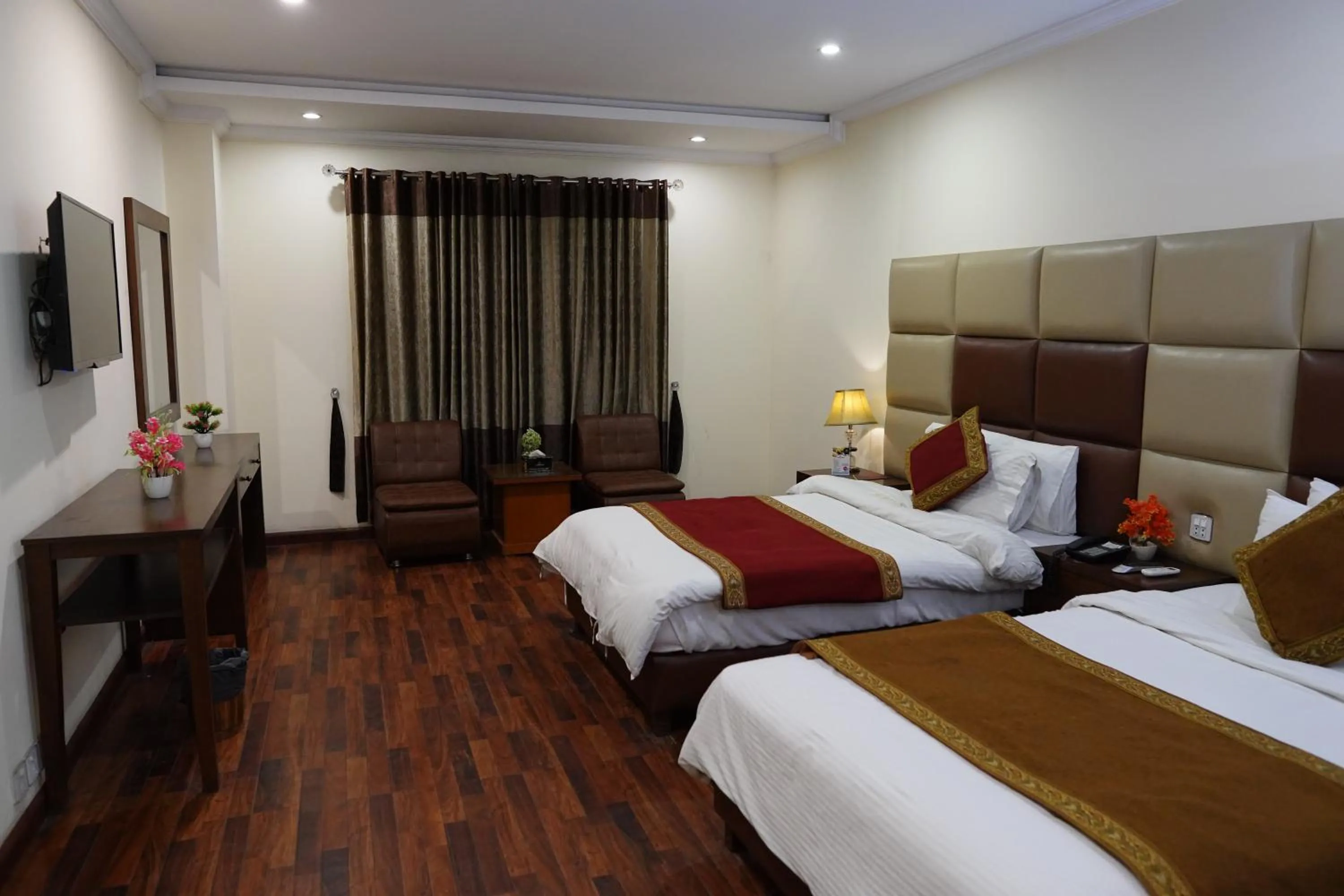 Bed in Grand Millennium Hotel