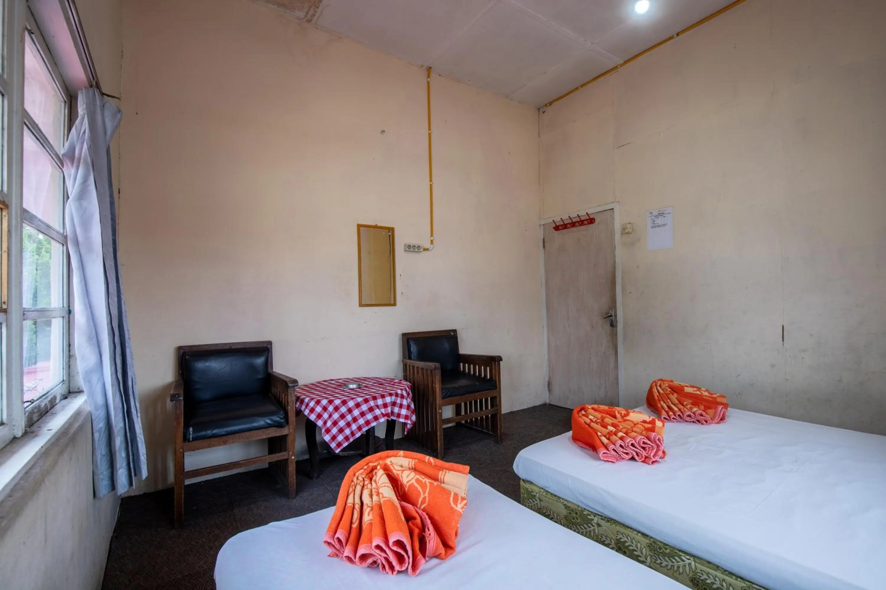 Seating area, Bed in Hotel Jogja Bukittinggi