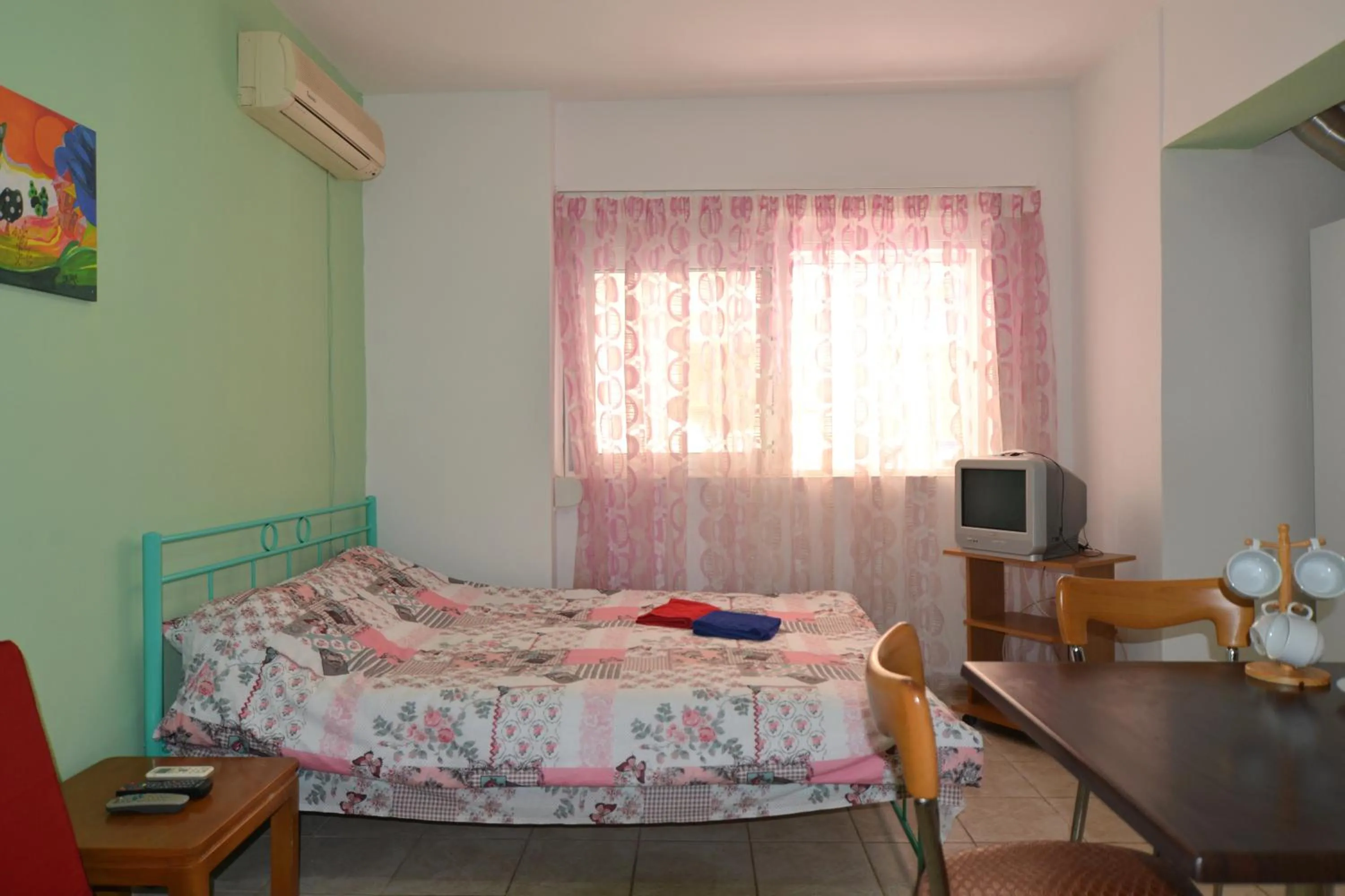 Bed in Economy Studio Apartments