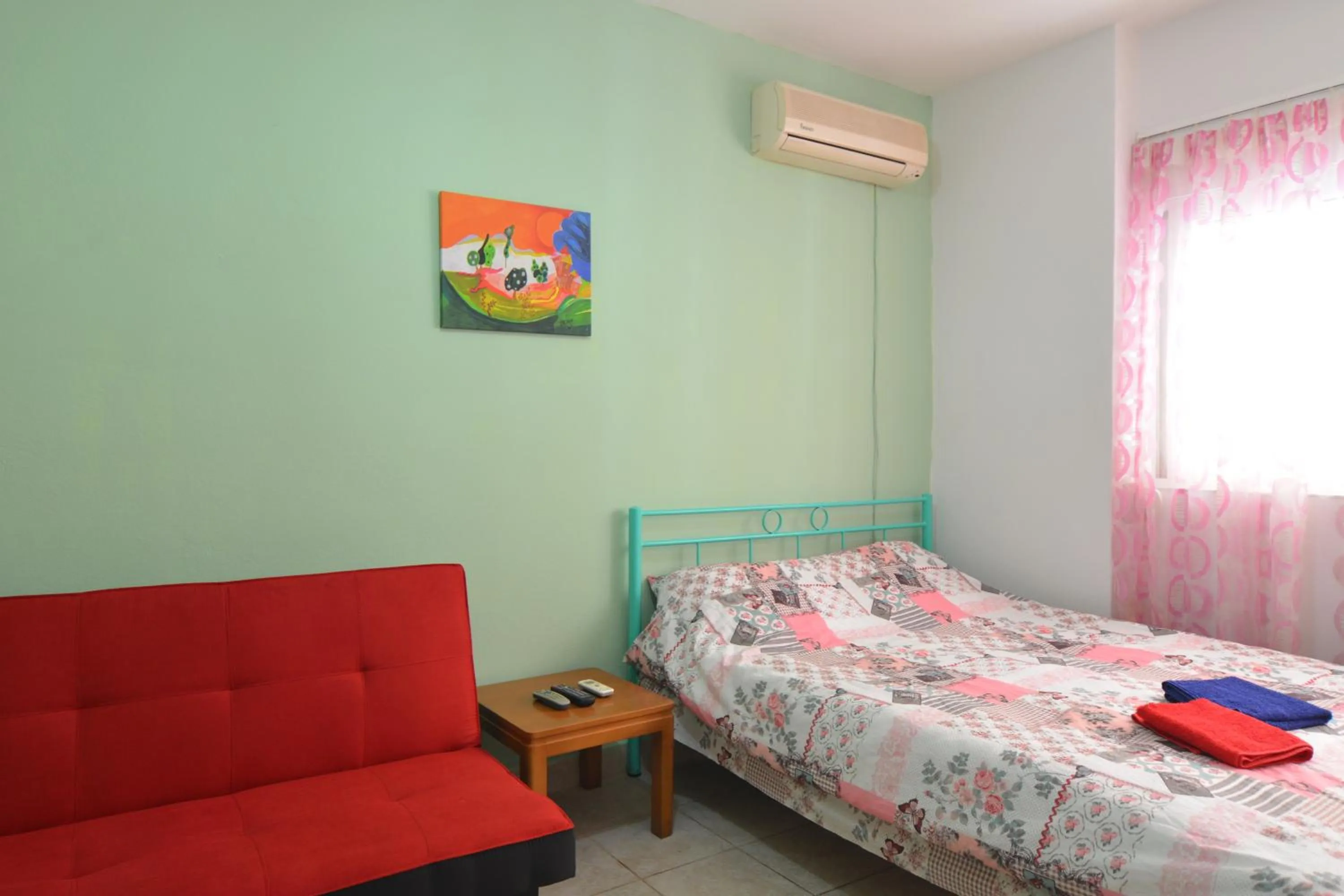 Bed in Economy Studio Apartments