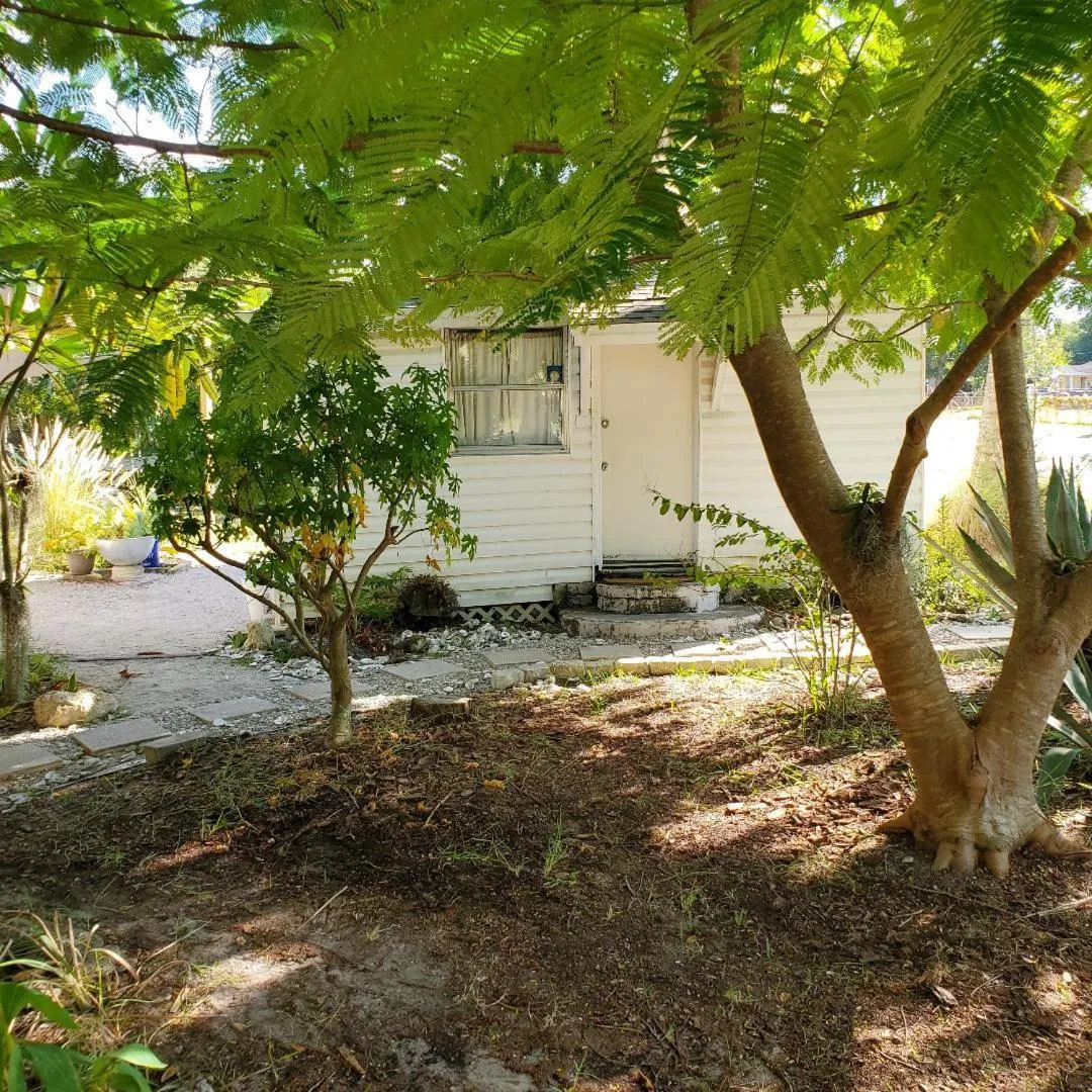 Property building in 1 Beige Cozy Bungalow or 1 White Cozy Efficiency Cottage in Titusville