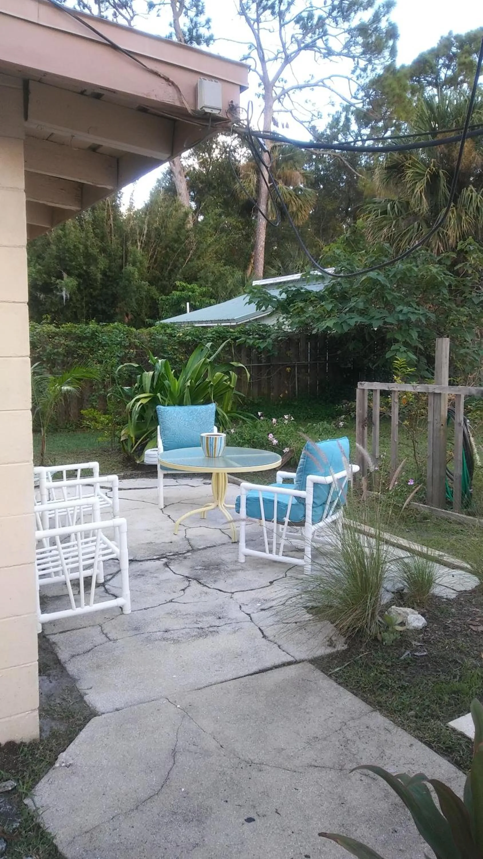 Patio in 1 Beige Cozy Bungalow or 1 White Cozy Efficiency Cottage in Titusville