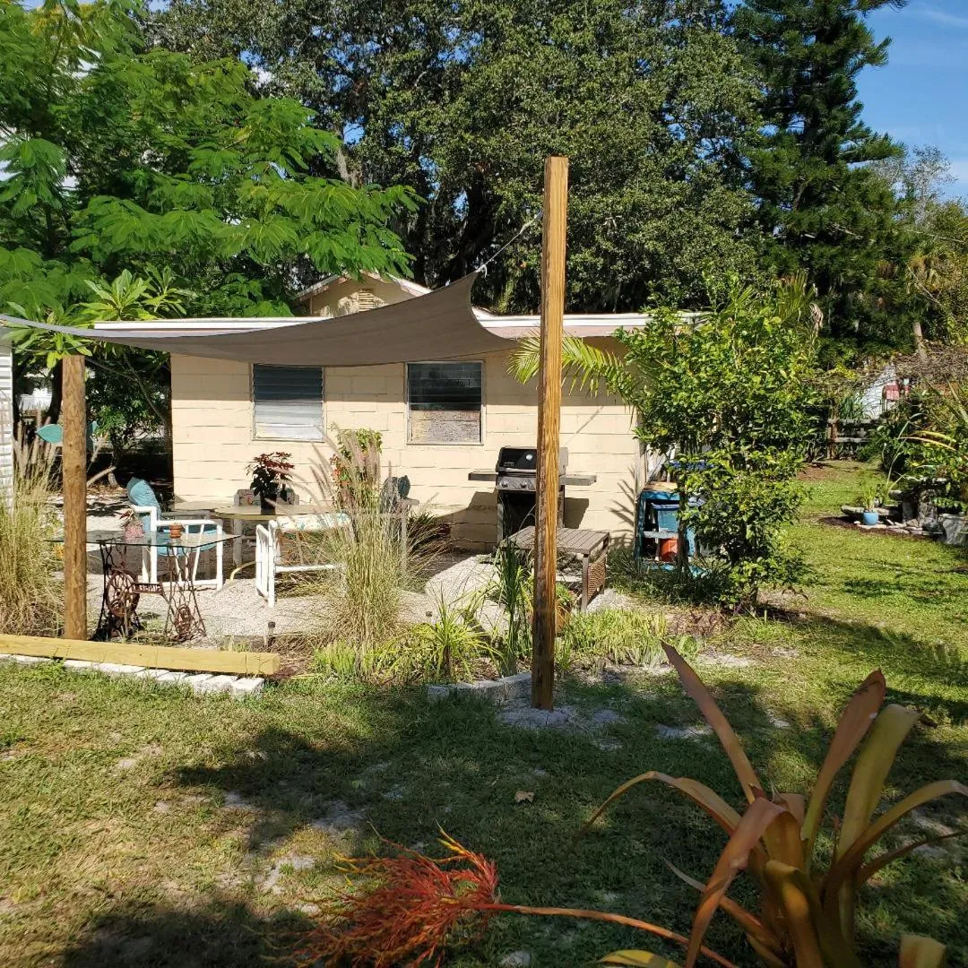 Property building in 1 Beige Cozy Bungalow or 1 White Cozy Efficiency Cottage in Titusville