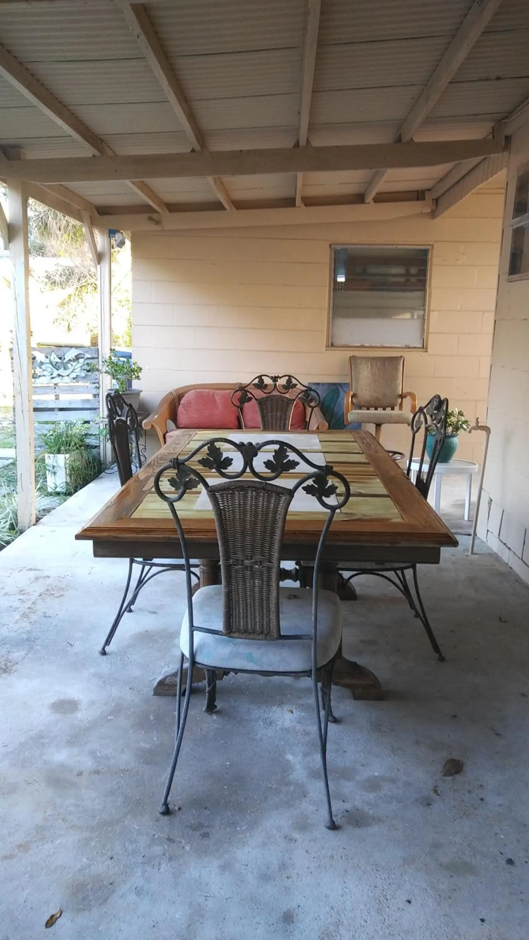 Seating area in 1 Beige Cozy Bungalow or 1 White Cozy Efficiency Cottage in Titusville