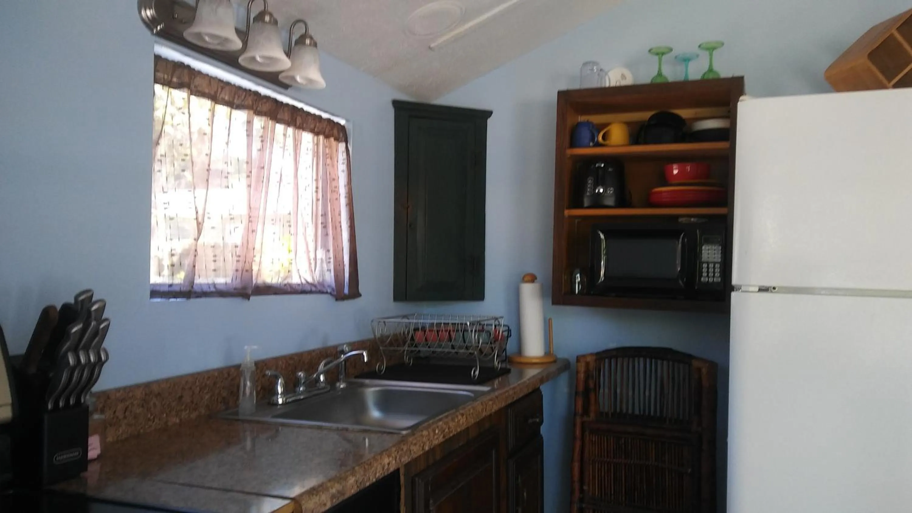 Kitchen or kitchenette in 1 Beige Cozy Bungalow or 1 White Cozy Efficiency Cottage in Titusville