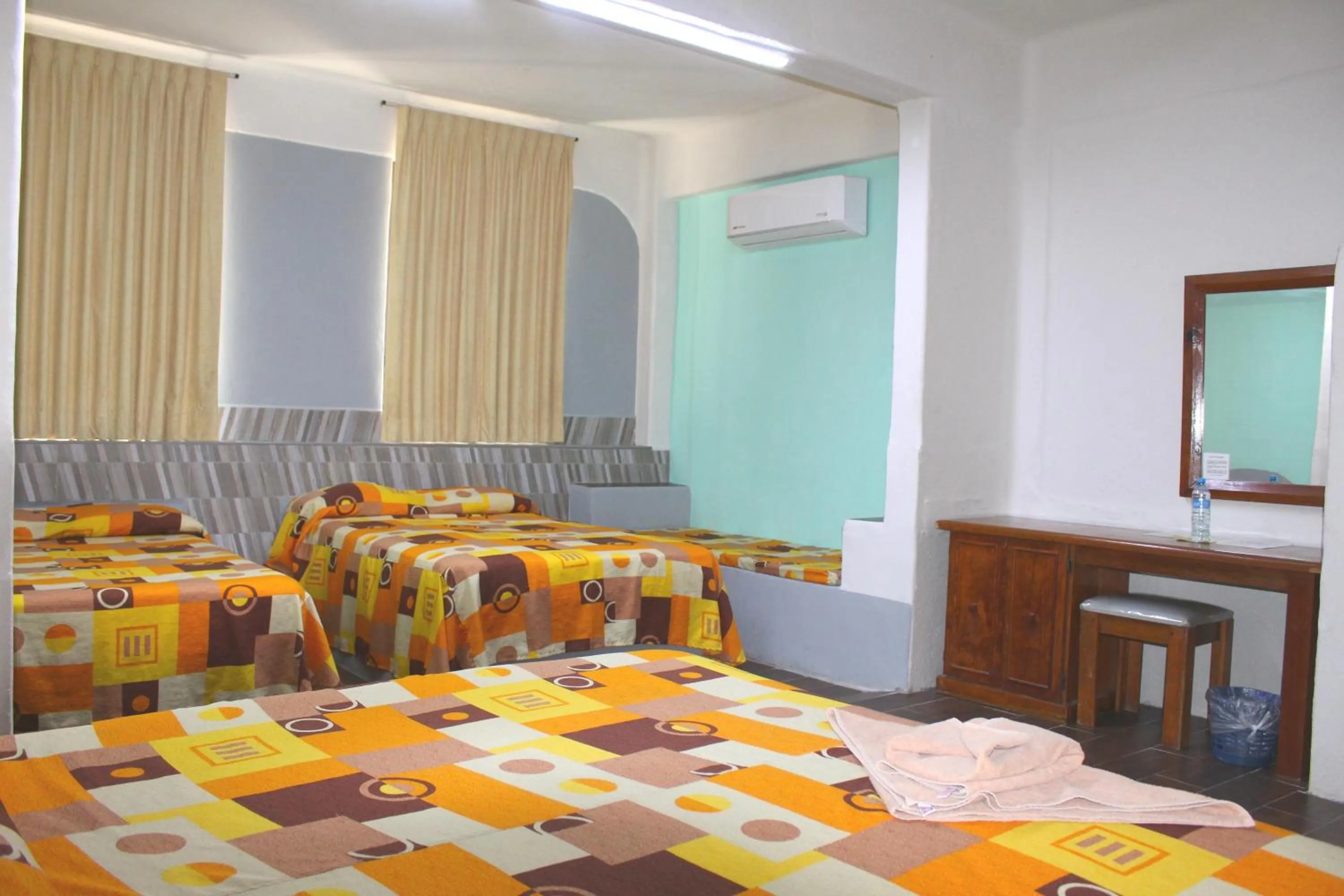 Bed in Hotel Arrecife Huatulco Plus