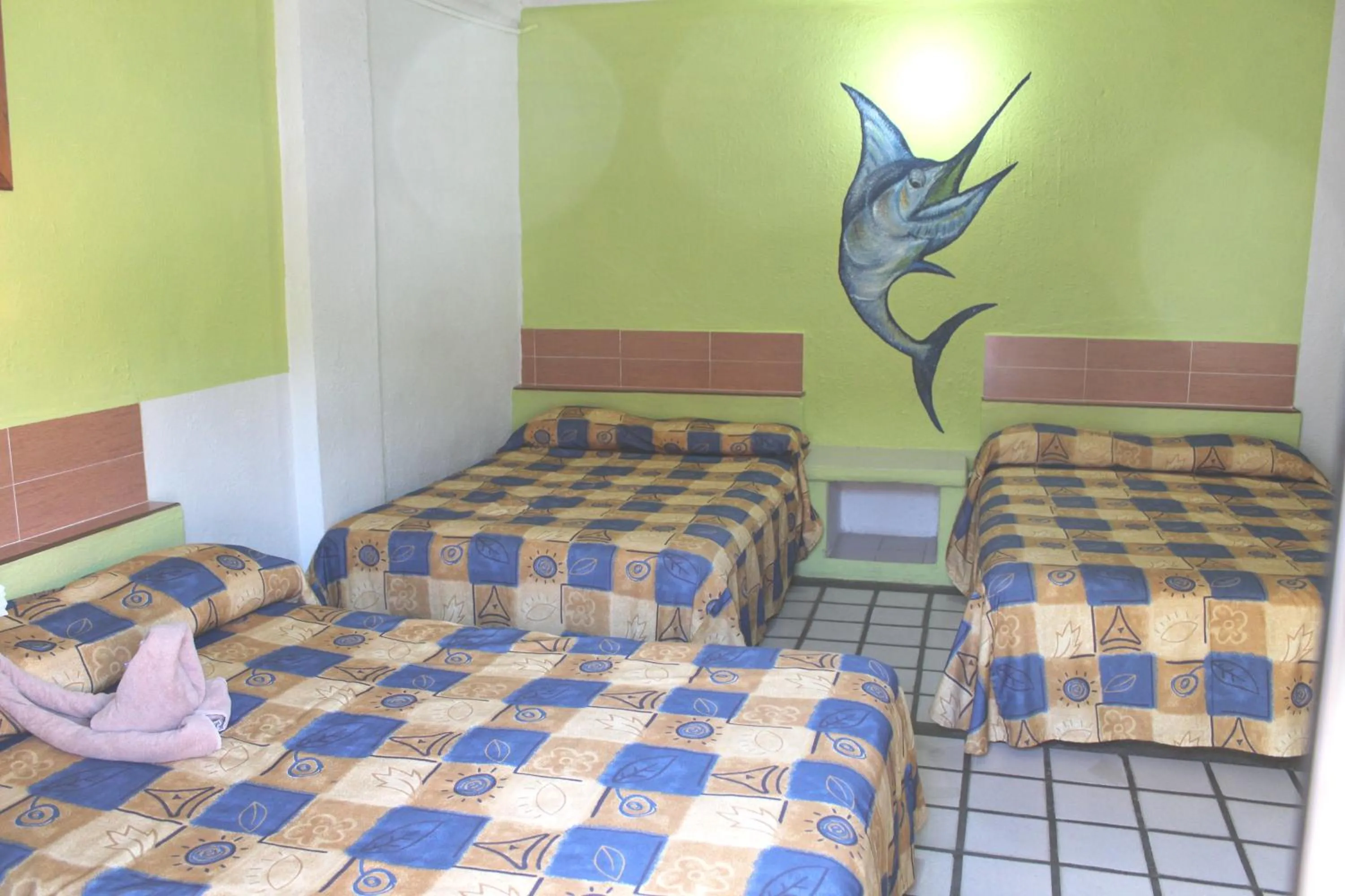 Bed in Hotel Arrecife Huatulco Plus