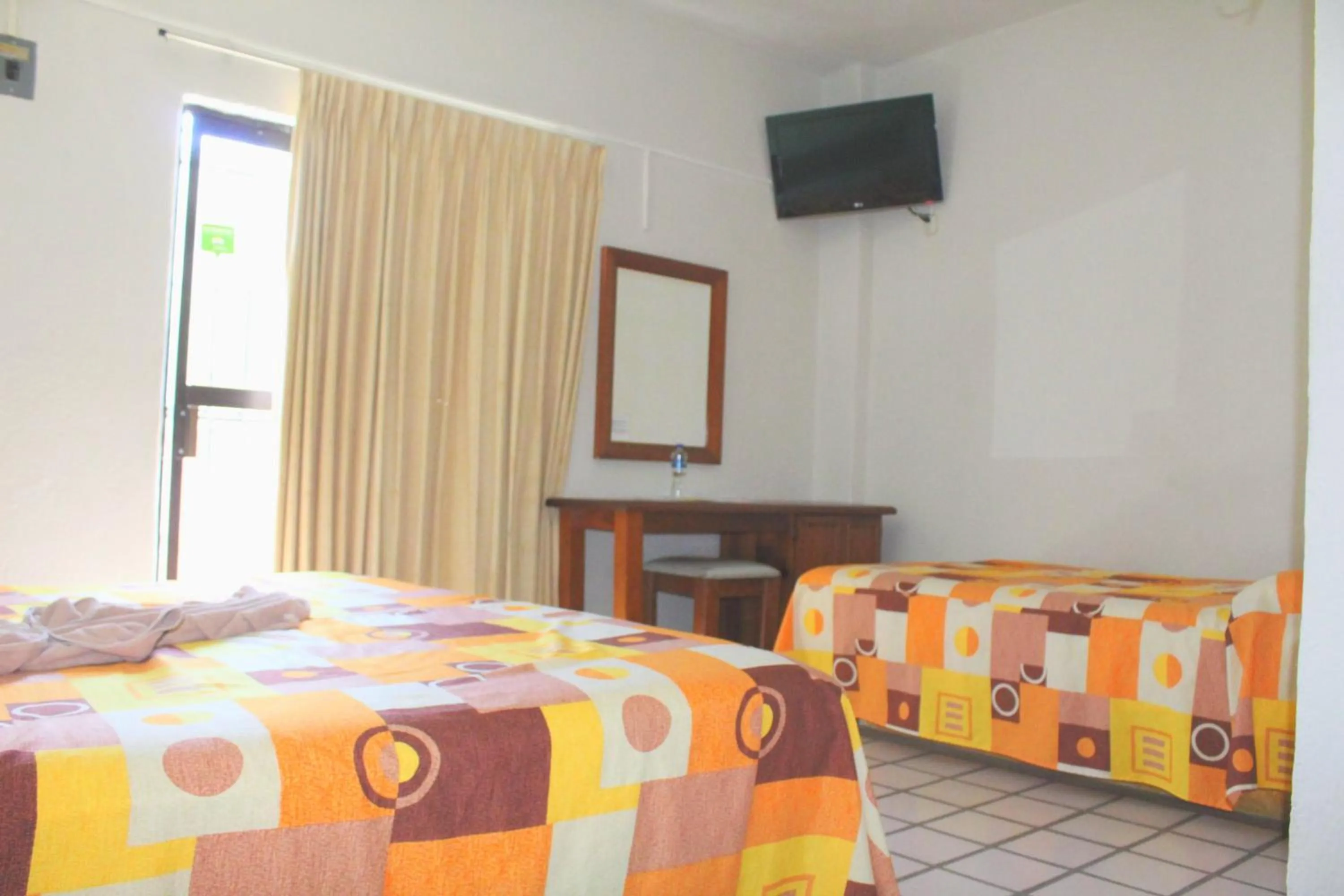 Bed in Hotel Arrecife Huatulco Plus