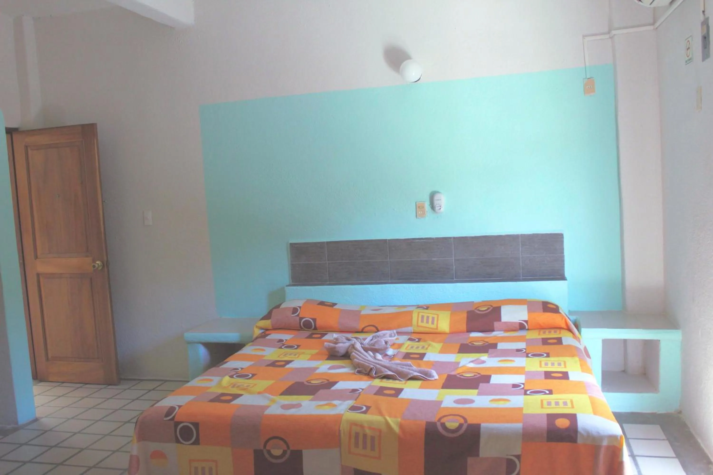 Bed in Hotel Arrecife Huatulco Plus