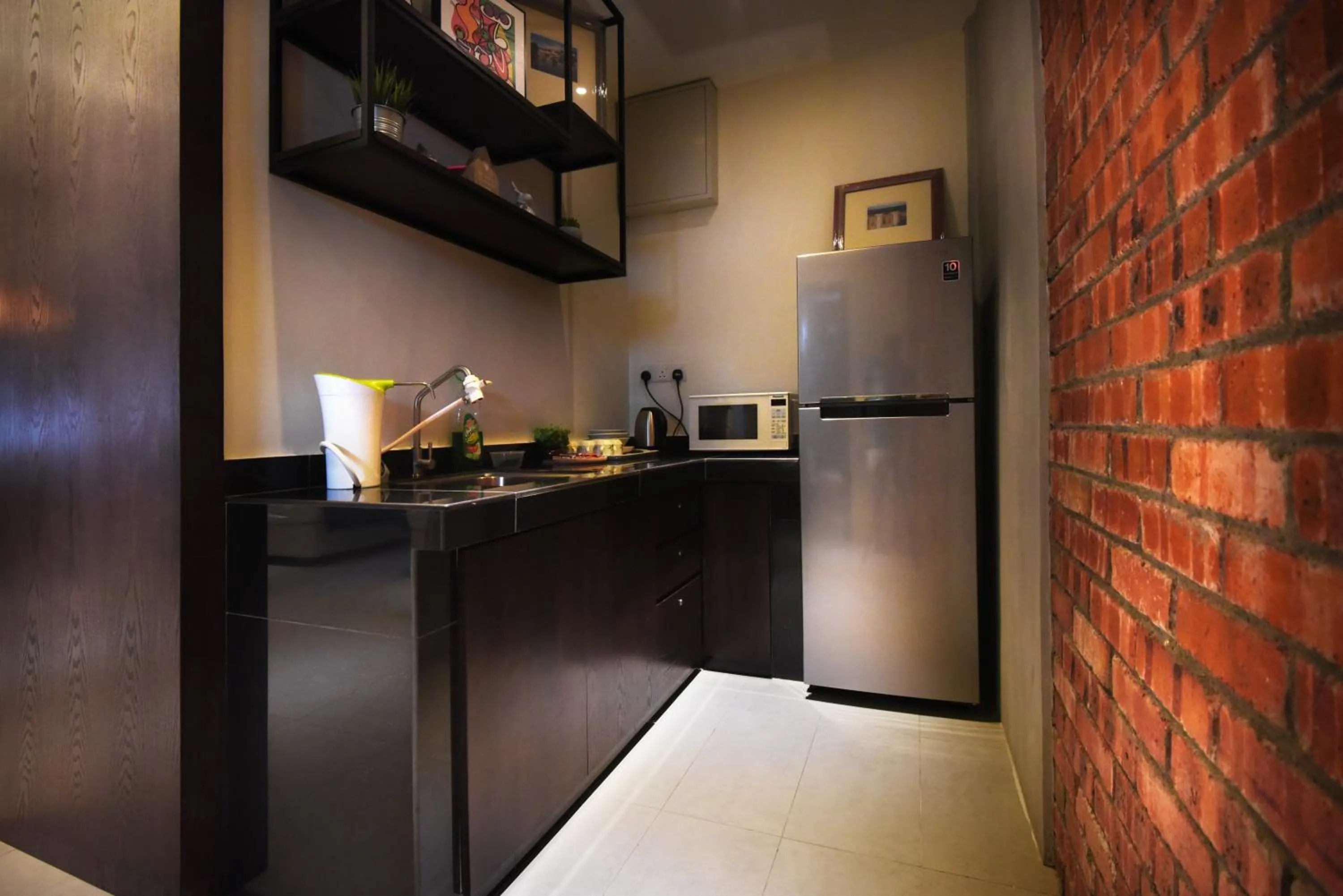 Kitchen or kitchenette in Backyard Rio Melaka