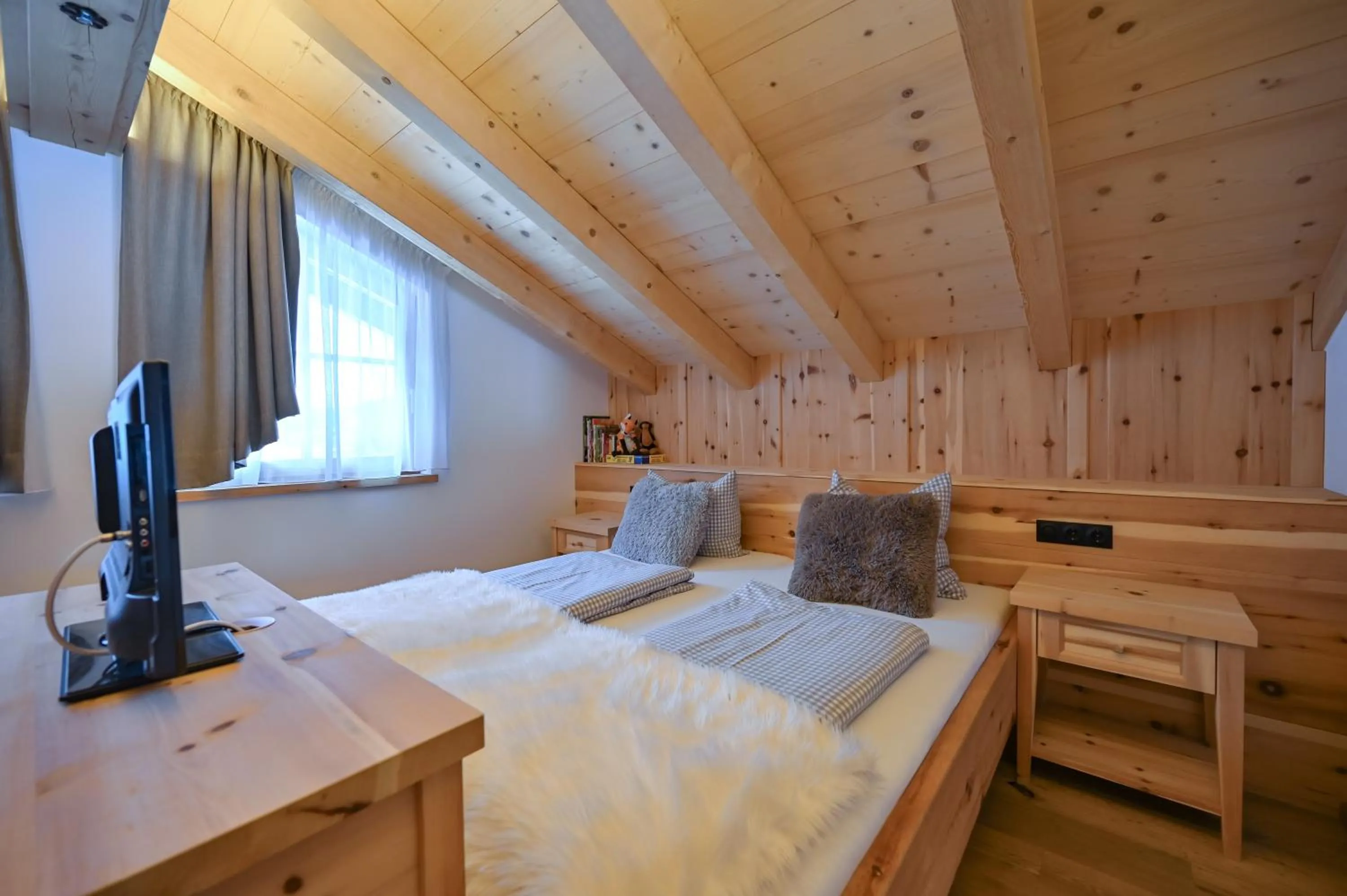 Bedroom, Bed in Braito's Seaside Lodges und Suites, Ferienhäuser und Ferienwohnungen